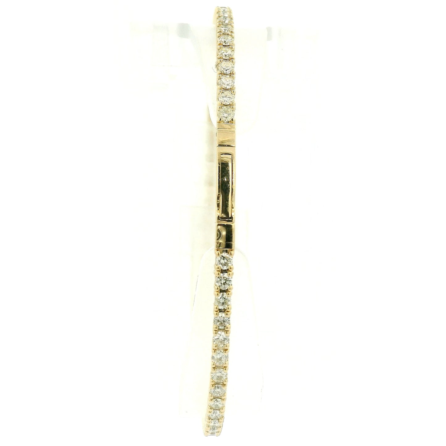 A Yellow Gold flex diamond bangle bracelet with diamonds all the way around at Forever Rox Fine Jewelry, Lake Tahoes Best Jewelry Store
