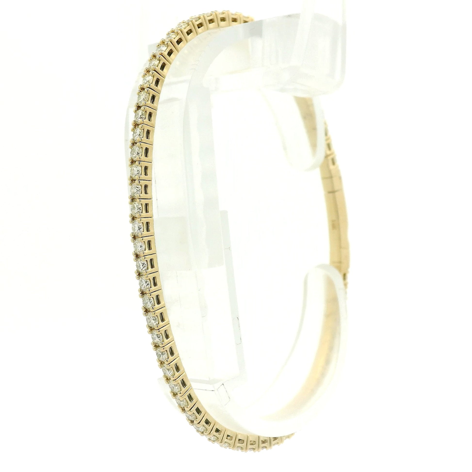 A Yellow Gold flex diamond bangle bracelet with diamonds all the way around at Forever Rox Fine Jewelry, Lake Tahoes Best Jewelry Store
