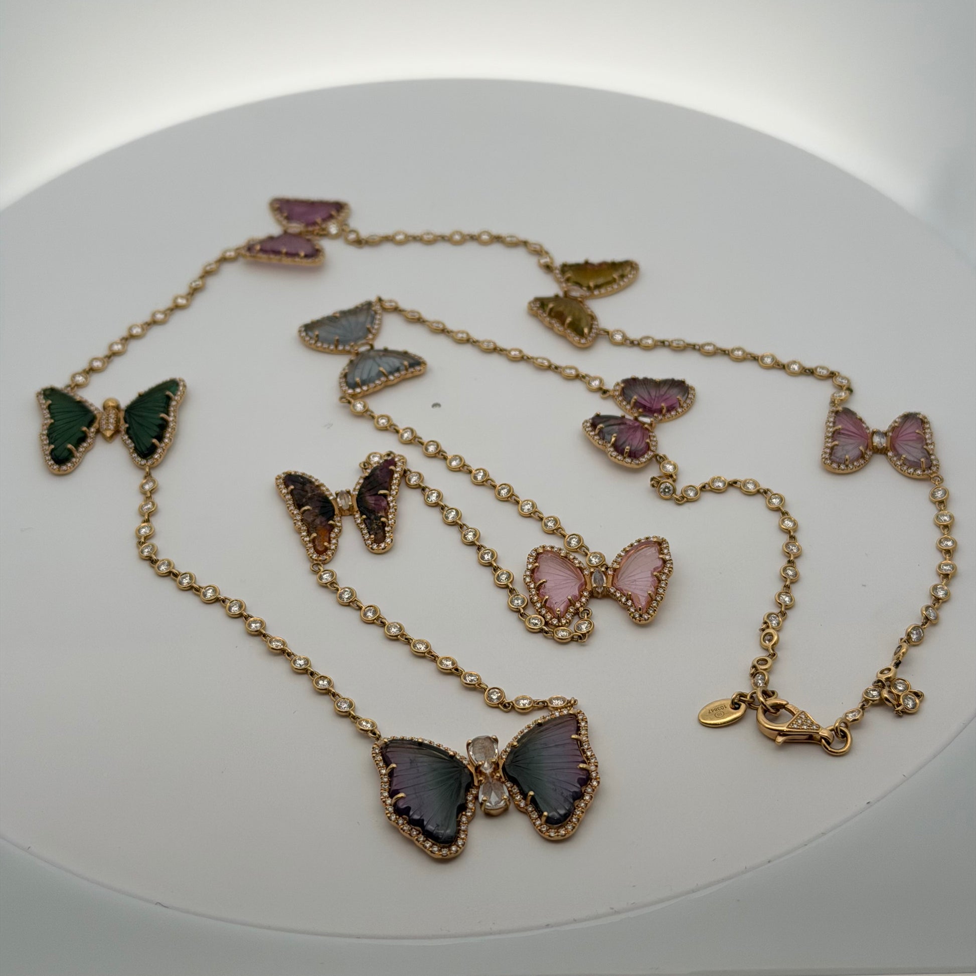 A Yellow Gold Diamond by The Yard Necklace with a 9 tourmaline & diamond butterflies at Forever Rox Fine Jewelry, Lake Tahoes Best Jewelry Store
