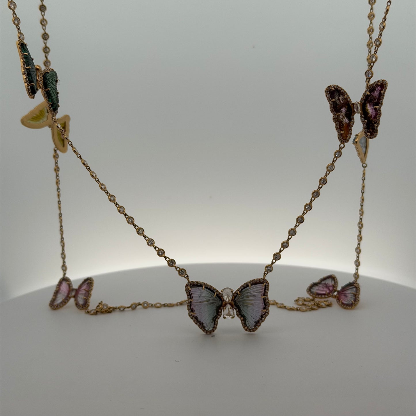 A Yellow Gold Diamond by The Yard Necklace with a 9 tourmaline & diamond butterflies at Forever Rox Fine Jewelry, Lake Tahoes Best Jewelry Store
