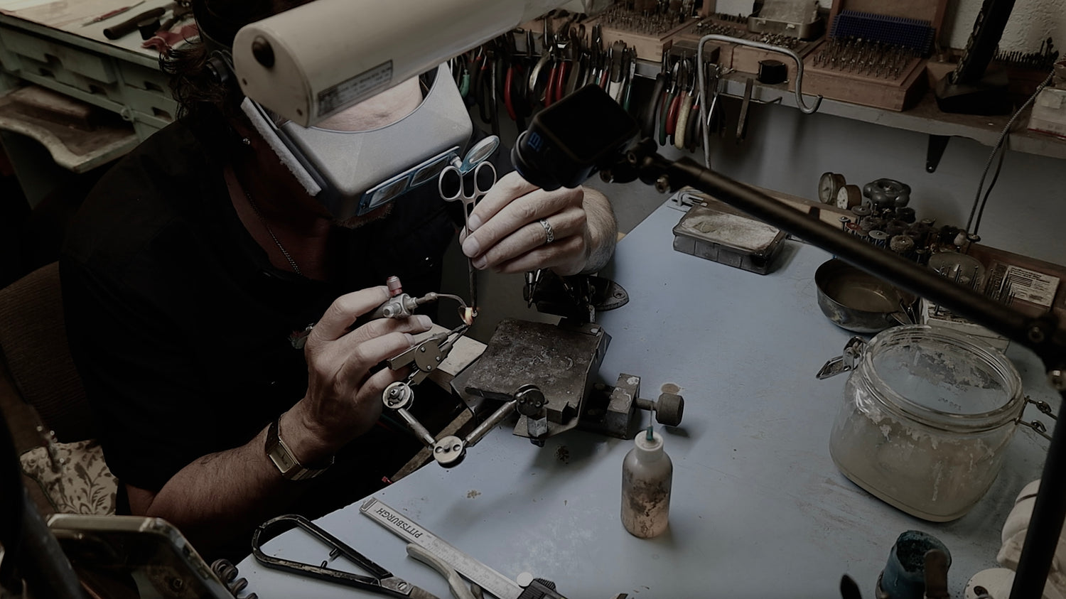 John Roxburgh The Jeweler at Forever Rox Fine Jewelry repairing a diamond ring