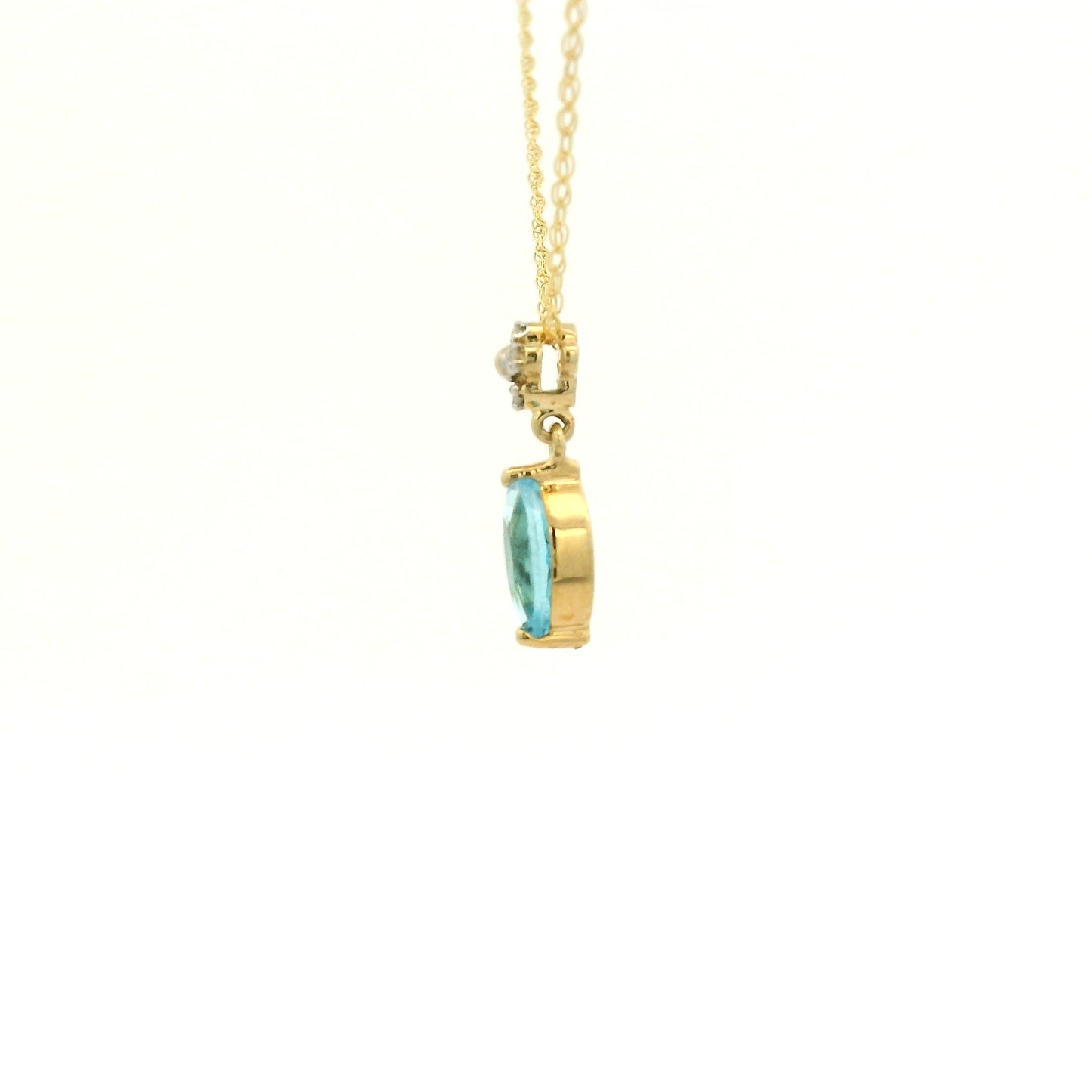 Yellow Gold Pendant with a prong set marquise cut natural Blue Topaz in the center with 4 diamonds at Forever Rox Fine Jewelry, Lake Tahoes Best Jewelry Store
