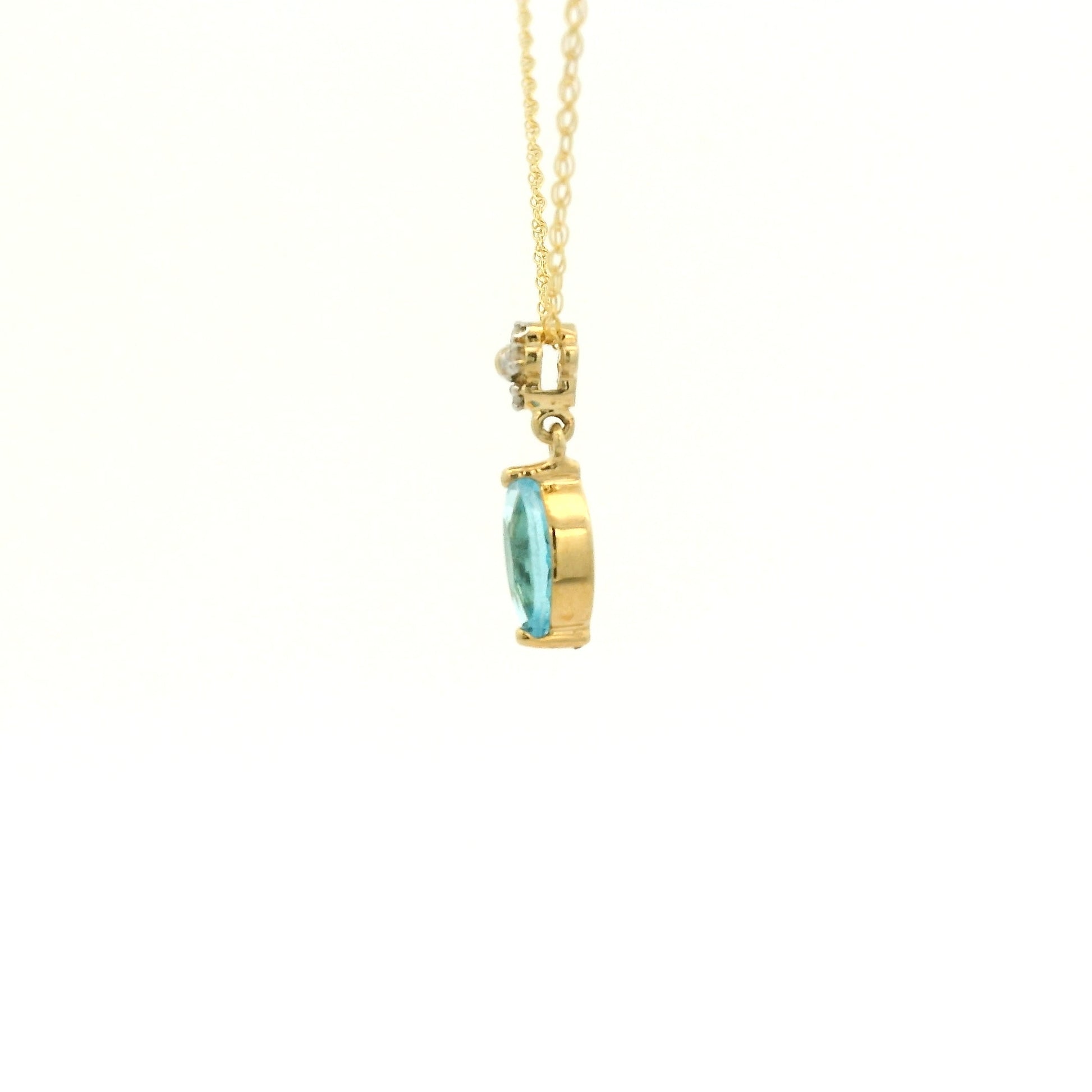 Yellow Gold Pendant with a prong set marquise cut natural Blue Topaz in the center with 4 diamonds at Forever Rox Fine Jewelry, Lake Tahoes Best Jewelry Store
