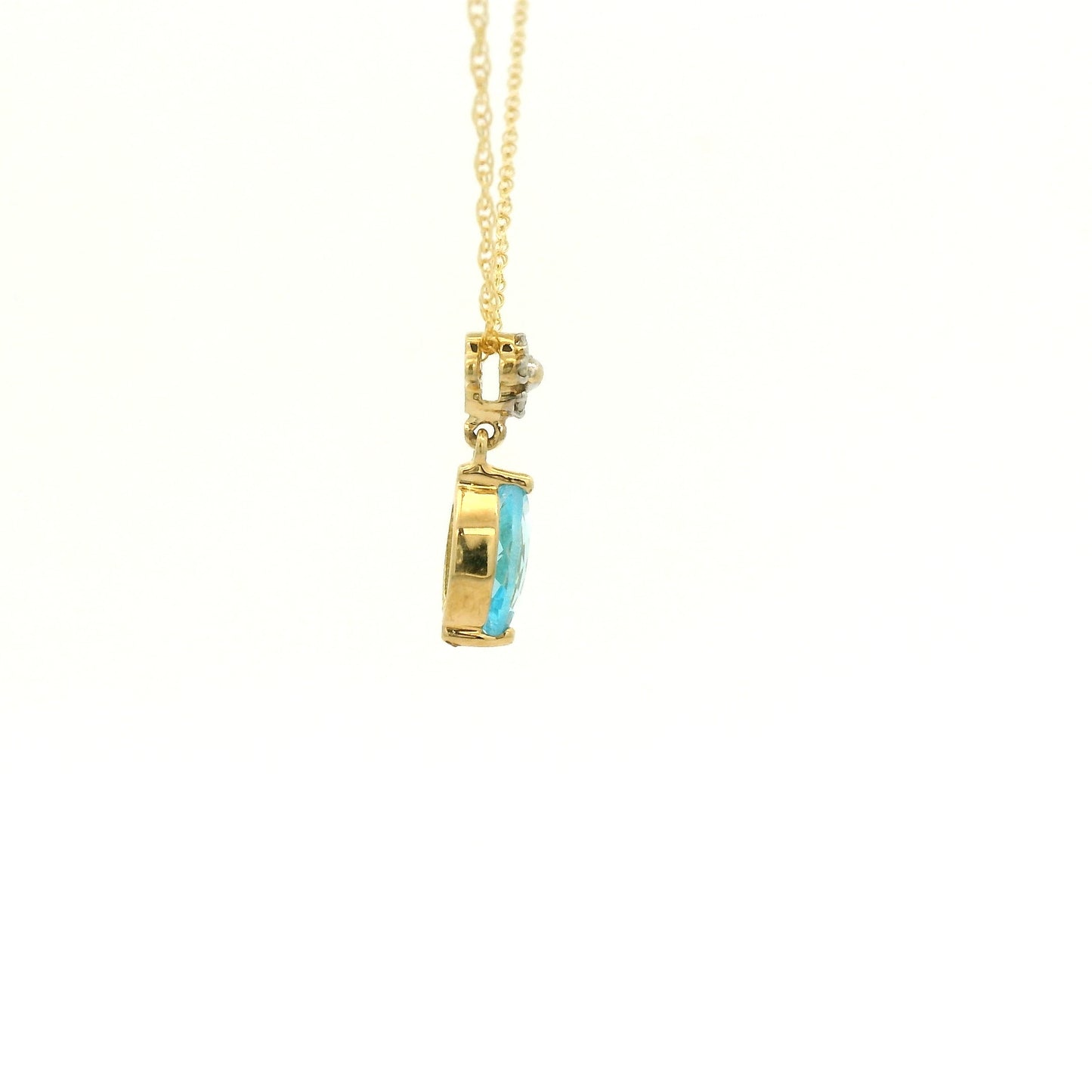 Yellow Gold Pendant with a prong set marquise cut natural Blue Topaz in the center with 4 diamonds at Forever Rox Fine Jewelry, Lake Tahoes Best Jewelry Store
