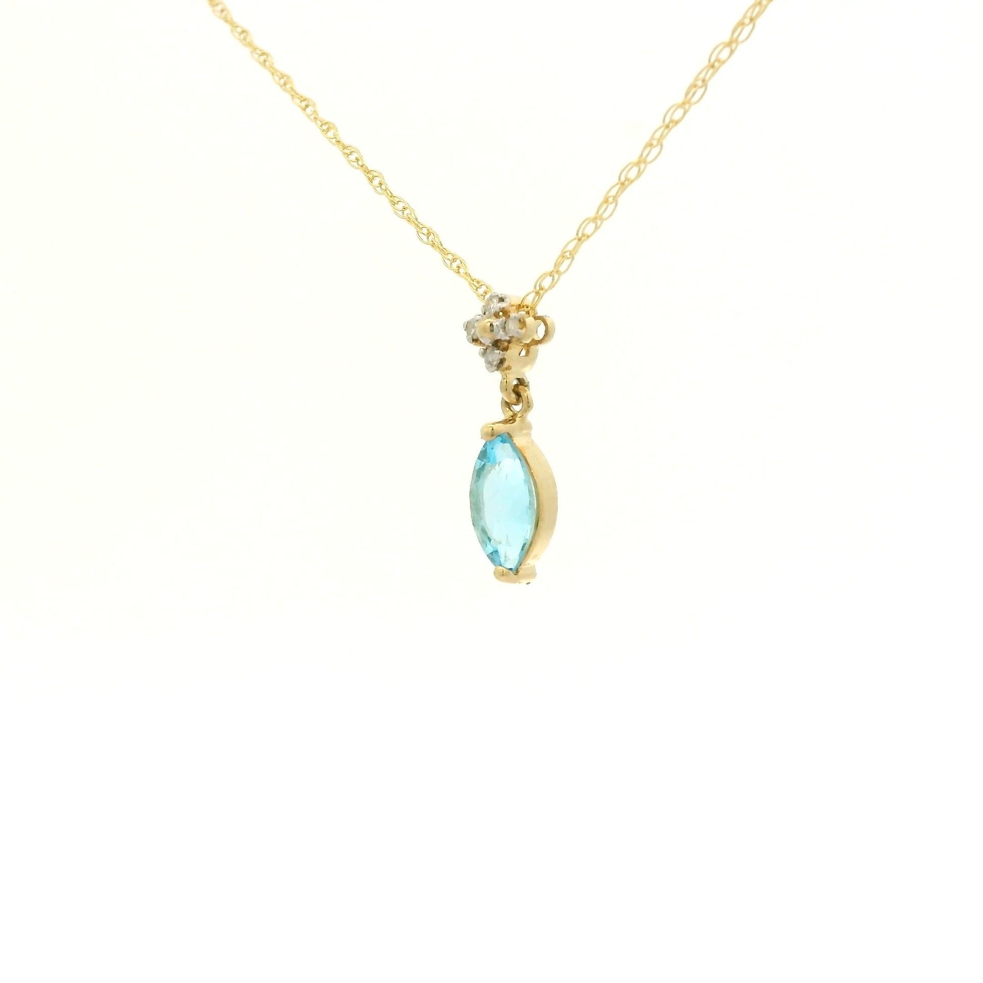 Yellow Gold Pendant with a prong set marquise cut natural Blue Topaz in the center with 4 diamonds at Forever Rox Fine Jewelry, Lake Tahoes Best Jewelry Store
