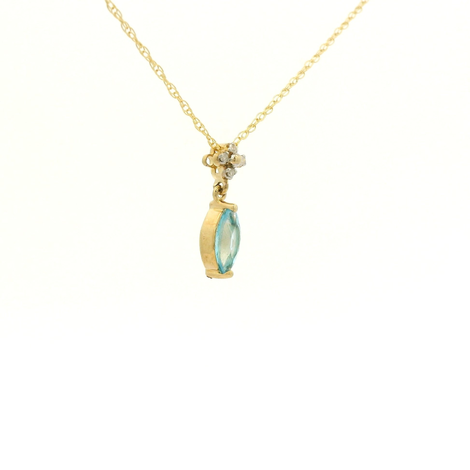 Yellow Gold Pendant with a prong set marquise cut natural Blue Topaz in the center with 4 diamonds at Forever Rox Fine Jewelry, Lake Tahoes Best Jewelry Store
