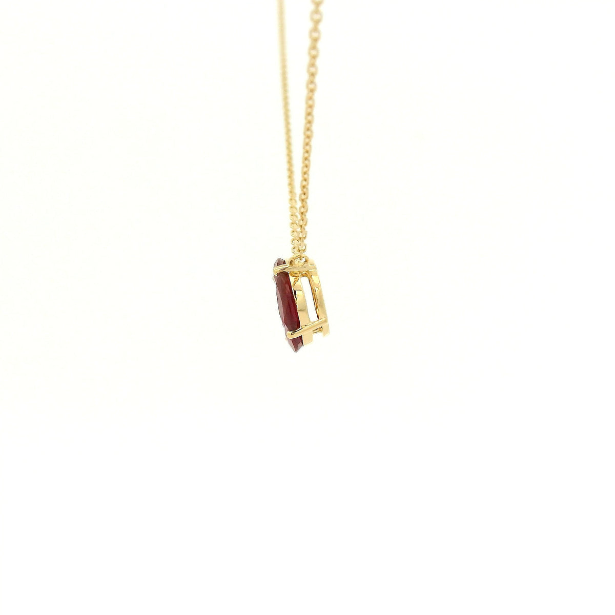 A Yellow Gold Pendant with a round cut diamond in the center & 4 marquise cut rubies in a circle around it at Forever Rox Fine Jewelry, Lake Tahoes Best Jewelry Store