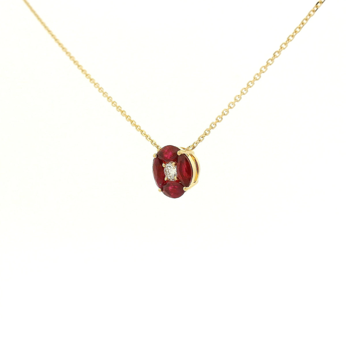 A Yellow Gold Pendant with a round cut diamond in the center & 4 marquise cut rubies in a circle around it at Forever Rox Fine Jewelry, Lake Tahoes Best Jewelry Store