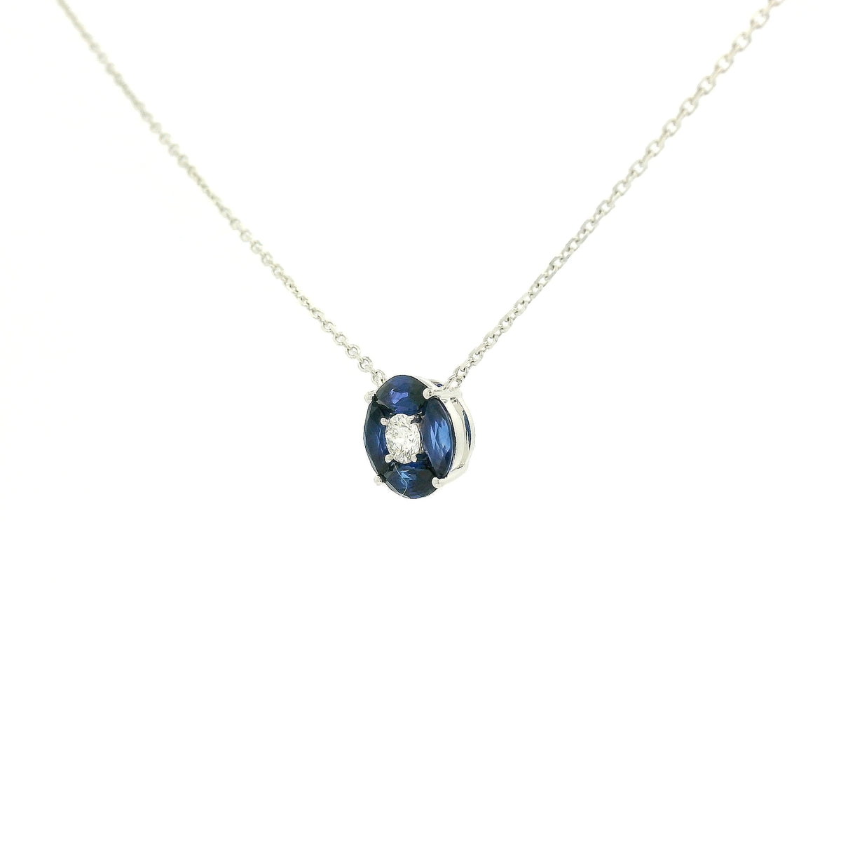A White Gold Pendant with a round cut diamond in the center & 4 marquise cut Sapphires in a circle around it at Forever Rox Fine Jewelry, Lake Tahoes Best Jewelry Store