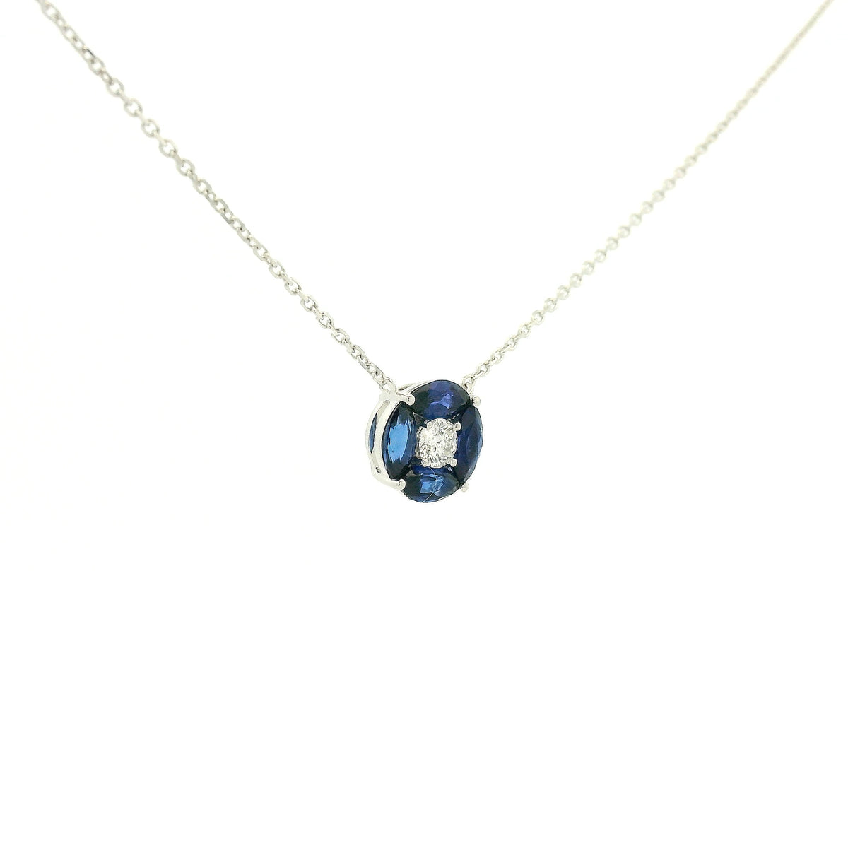 A White Gold Pendant with a round cut diamond in the center & 4 marquise cut Sapphires in a circle around it at Forever Rox Fine Jewelry, Lake Tahoes Best Jewelry Store