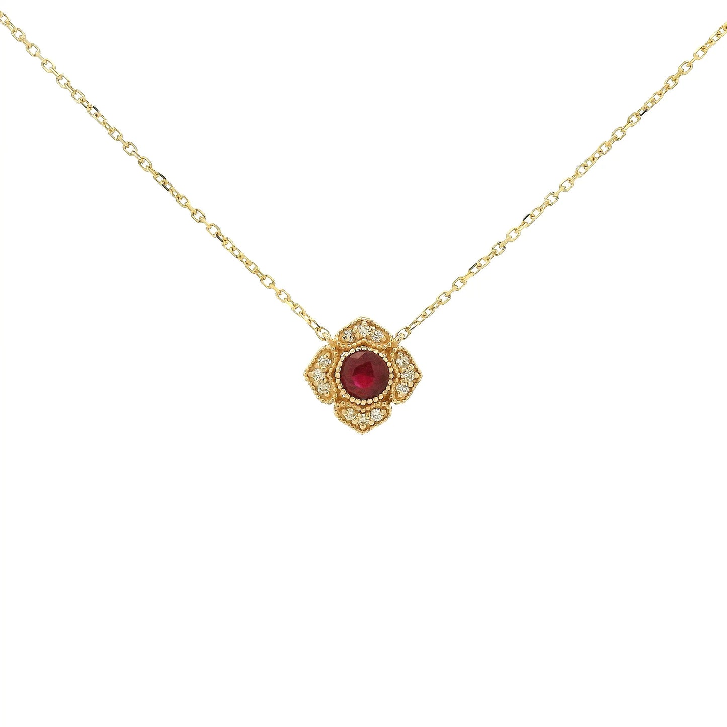 A Yellow Gold Flower Pendant with a milgrain bezel set round cut natural Ruby in the centerand diamonds with a chain attached at Forever Rox Fine Jewelry, Lake Tahoes Best Jewelry Store