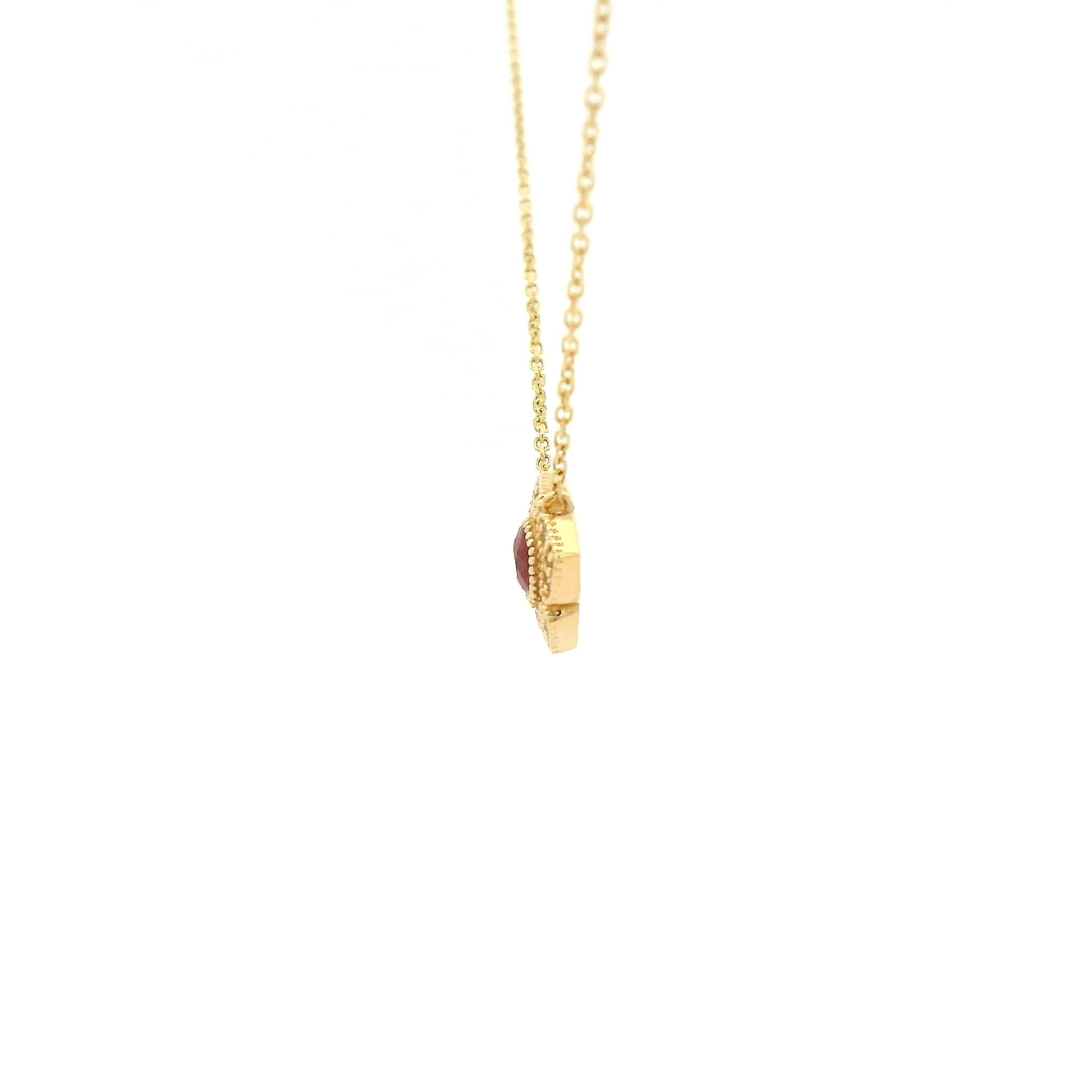 A Yellow Gold Flower Pendant with a milgrain bezel set round cut natural Ruby in the centerand diamonds with a chain attached at Forever Rox Fine Jewelry, Lake Tahoes Best Jewelry Store