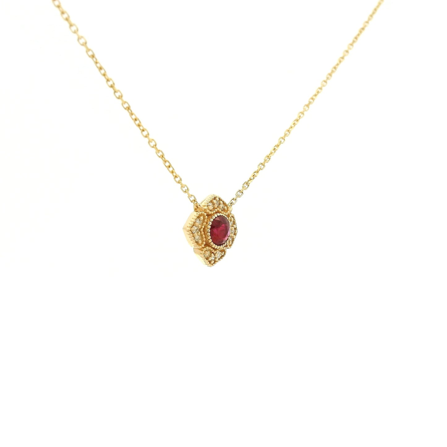 A Yellow Gold Flower Pendant with a milgrain bezel set round cut natural Ruby in the centerand diamonds with a chain attached at Forever Rox Fine Jewelry, Lake Tahoes Best Jewelry Store