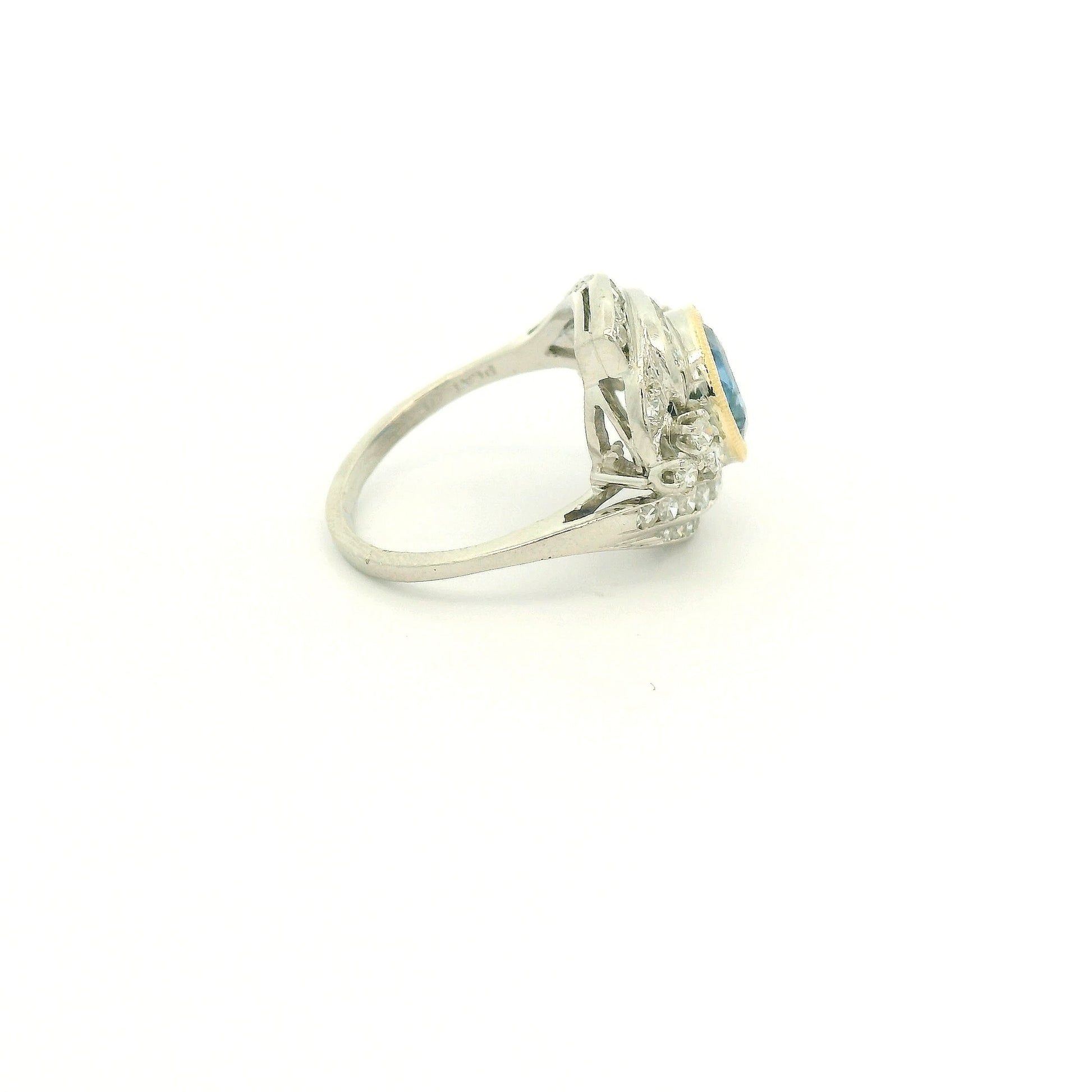 A Vintage Platinum & Yellow Gold Ring with a milgrain bezel set round cut natural Fine Blue Sapphire in the center with diamonds scattered around at Forever Rox Fine Jewelry, Lake Tahoes Best Jewelry Store