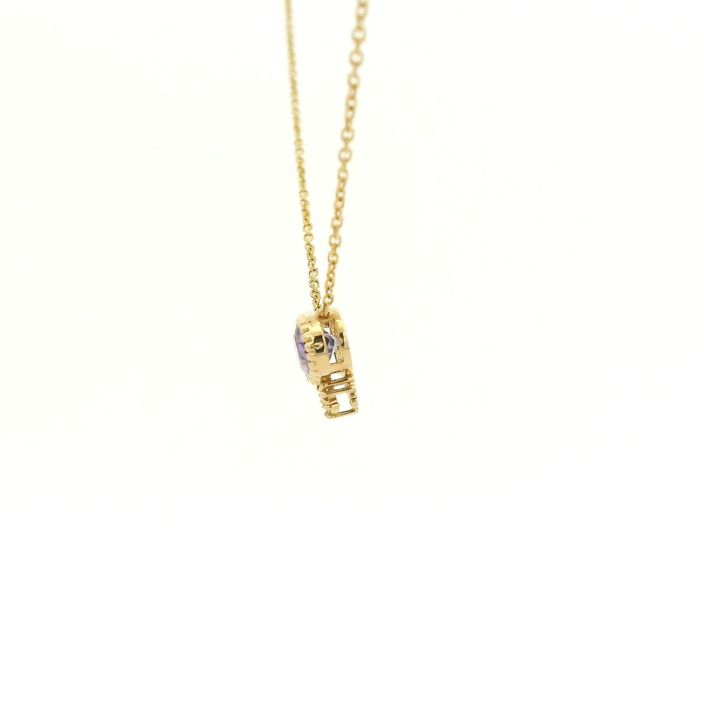 A Yellow Gold Pendant with a milgrain bezel set oval cut natural Amethyst in the center with 3 diamonds and a chain attached at Forever Rox Fine Jewelry, Lake Tahoes Best Jewelry Store