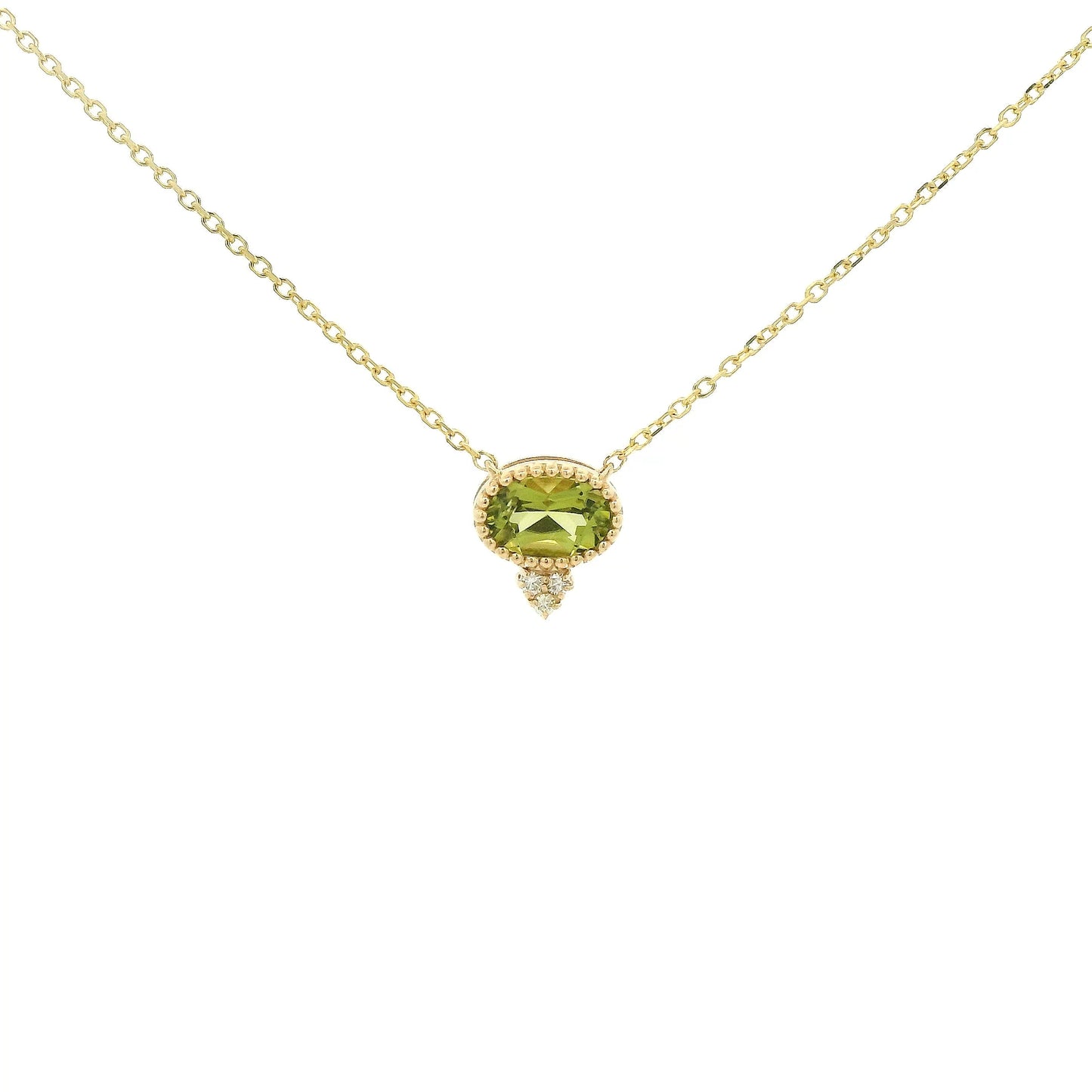 A Yellow Gold Pendant with a milgrain bezel set oval cut natural Peridot in the center with 3 diamonds and a chain attached at Forever Rox Fine Jewelry, Lake Tahoes Best Jewelry Store