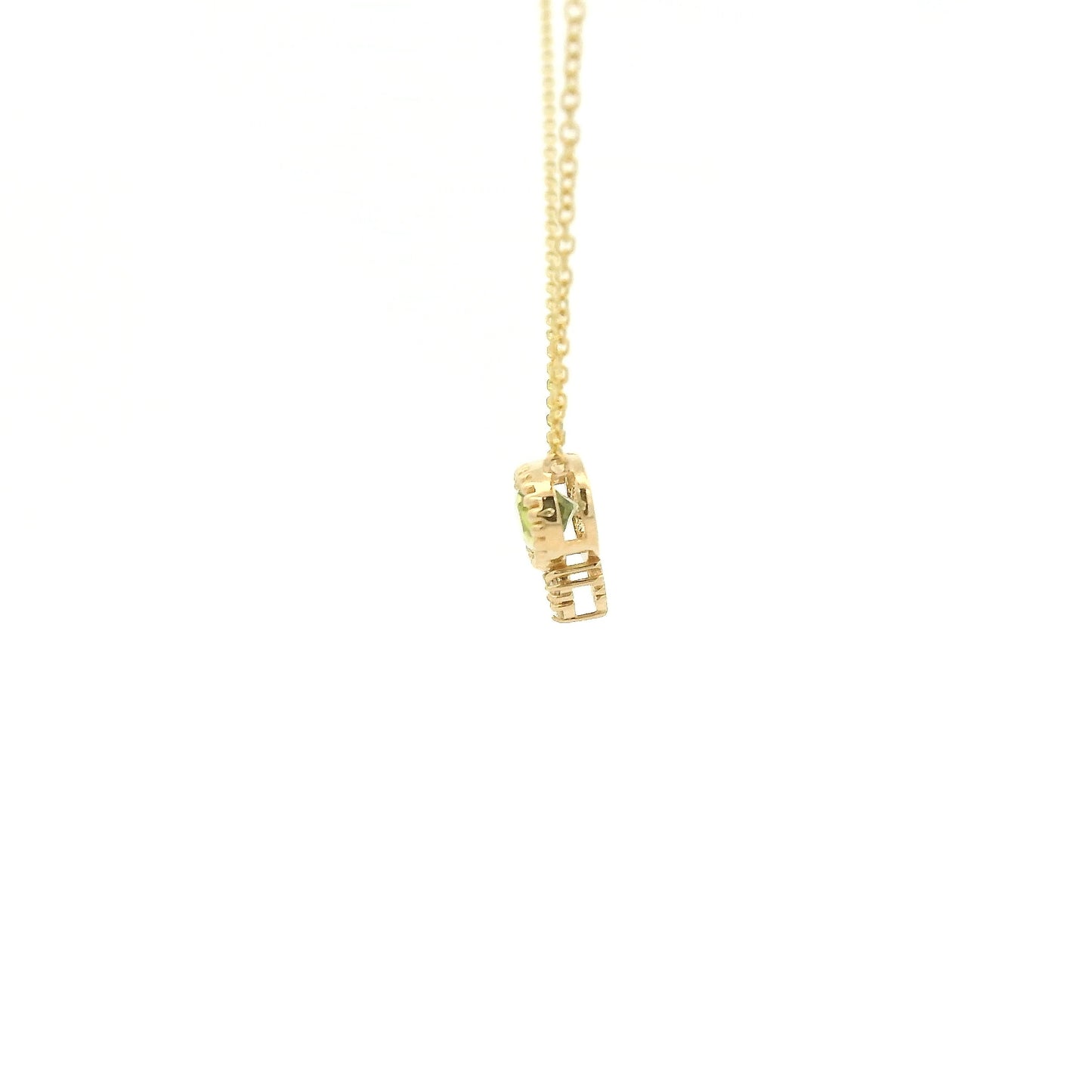 A Yellow Gold Pendant with a milgrain bezel set oval cut natural Peridot in the center with 3 diamonds and a chain attached at Forever Rox Fine Jewelry, Lake Tahoes Best Jewelry Store