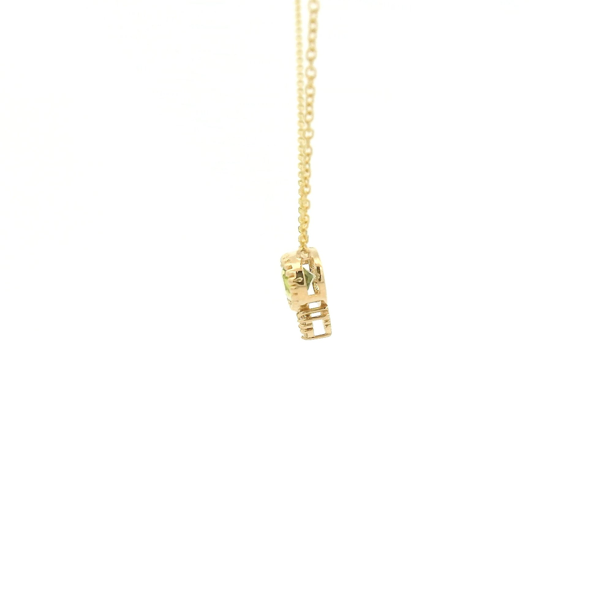 A Yellow Gold Pendant with a milgrain bezel set oval cut natural Peridot in the center with 3 diamonds and a chain attached at Forever Rox Fine Jewelry, Lake Tahoes Best Jewelry Store