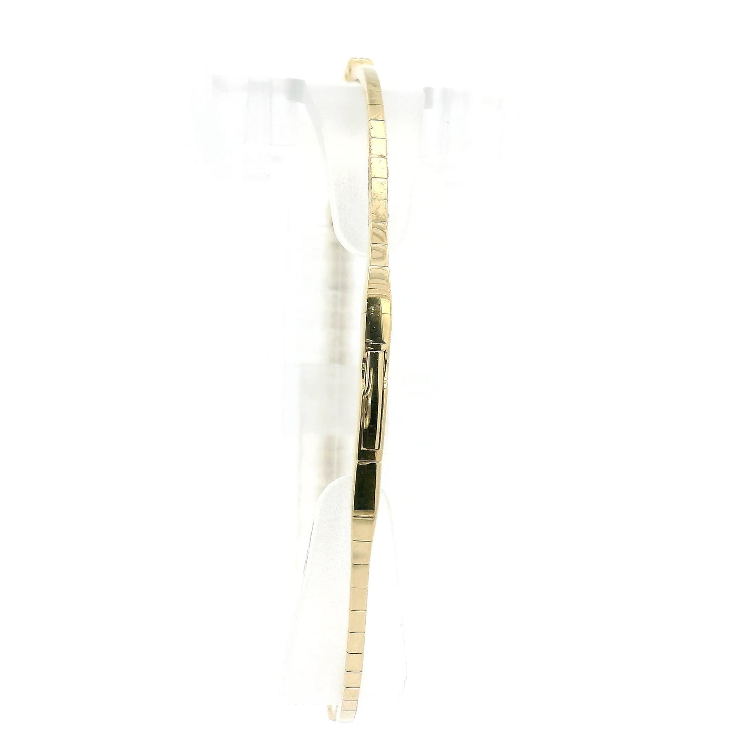 A Yellow Gold Flex Bangle Bracelet with milgrain bezel set round cut natural Diamonds in the center at Forever Rox Fine Jewelry, Lake Tahoes Best Jewelry Store