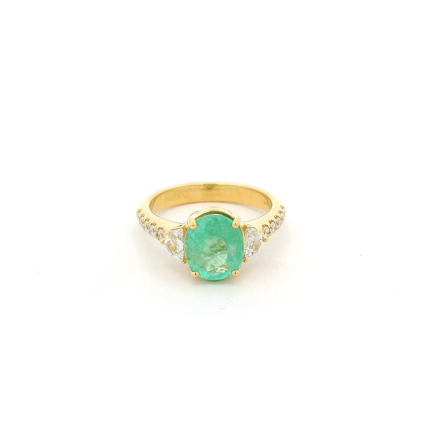 A Yellow Gold Ring with a prong set oval cut natural Green Paraíba Tourmaline in the center with two chevron cut diamonds next to it and diamonds down the shank at Forever Rox Fine Jewelry, Lake Tahoes Best Jewelry Store.