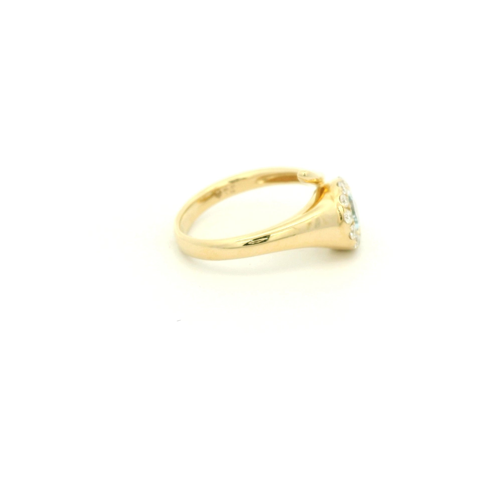 A Yellow Gold Ring with a bezel set pear cut natural Aquamarine in the center with a halo fo diamonds at Forever Rox Fine Jewelry, Lake Tahoes Best Jewelry Store