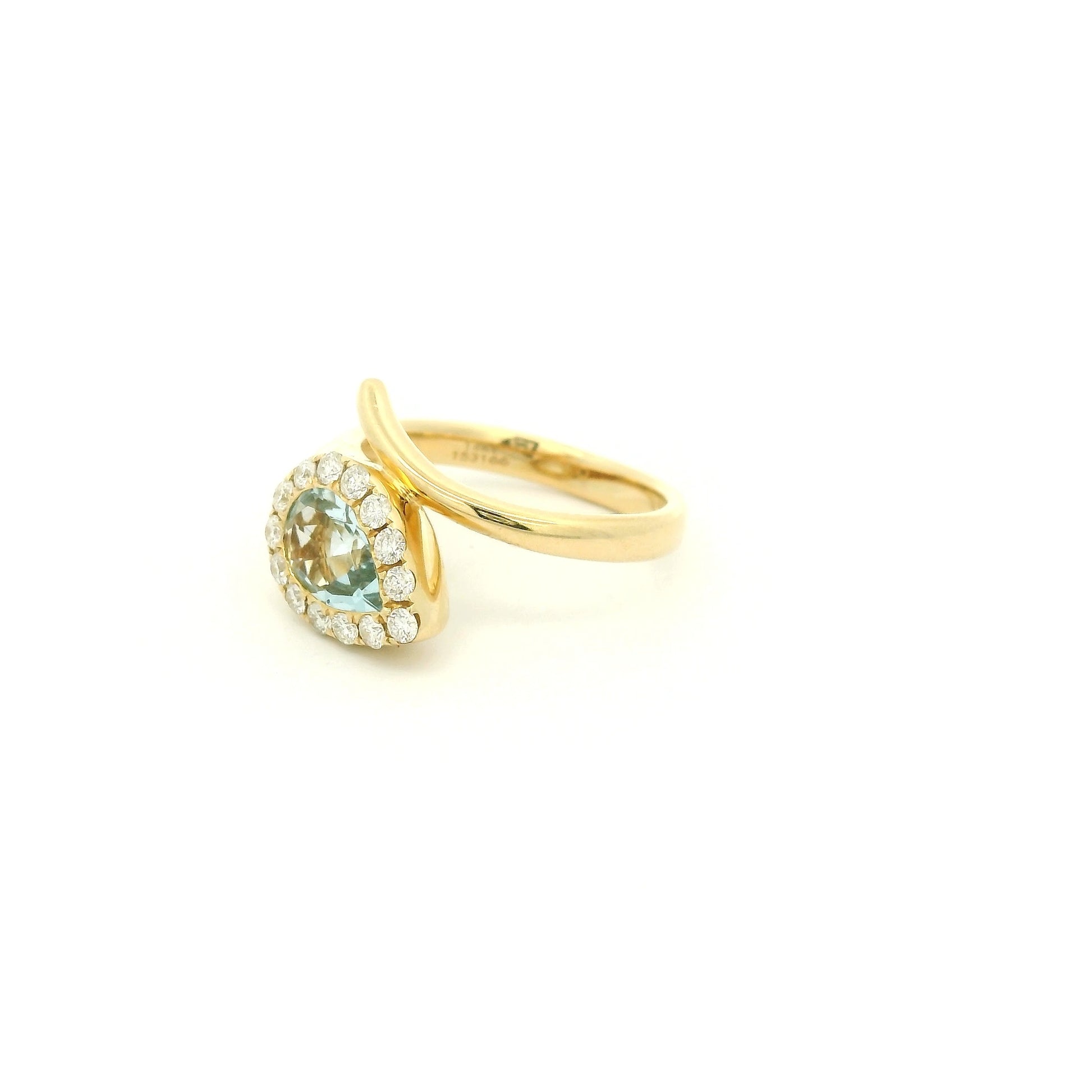 A Yellow Gold Ring with a bezel set pear cut natural Aquamarine in the center with a halo fo diamonds at Forever Rox Fine Jewelry, Lake Tahoes Best Jewelry Store