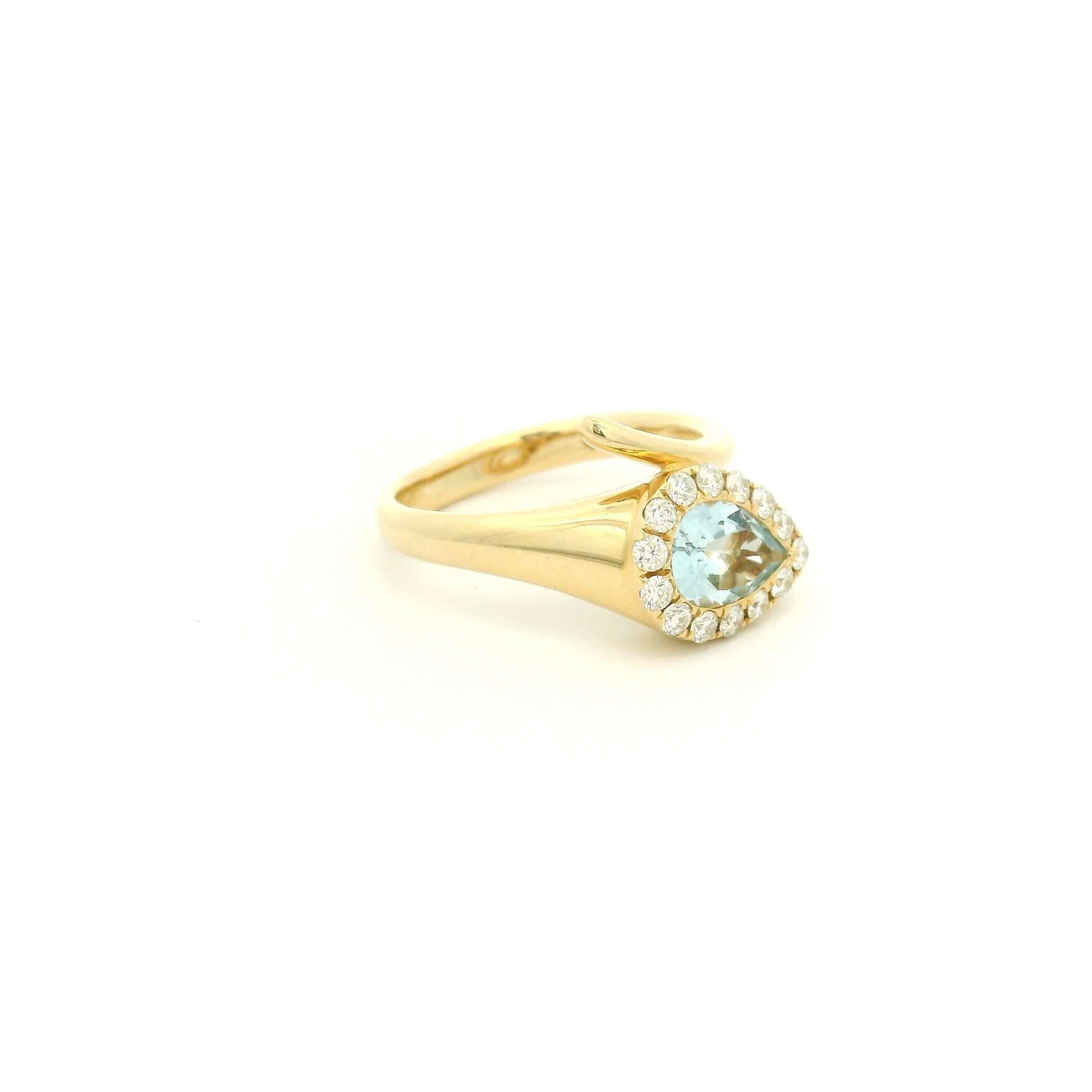 A Yellow Gold Ring with a bezel set pear cut natural Aquamarine in the center with a halo fo diamonds at Forever Rox Fine Jewelry, Lake Tahoes Best Jewelry Store