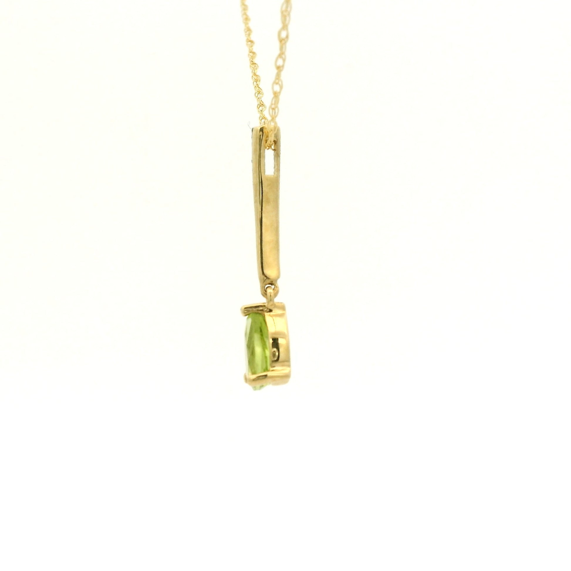 Yellow Gold Dangle Pendant with a prong set pear cut natural Peridot at Forever Rox Fine Jewelry, Lake Tahoes Best Jewelry Store
