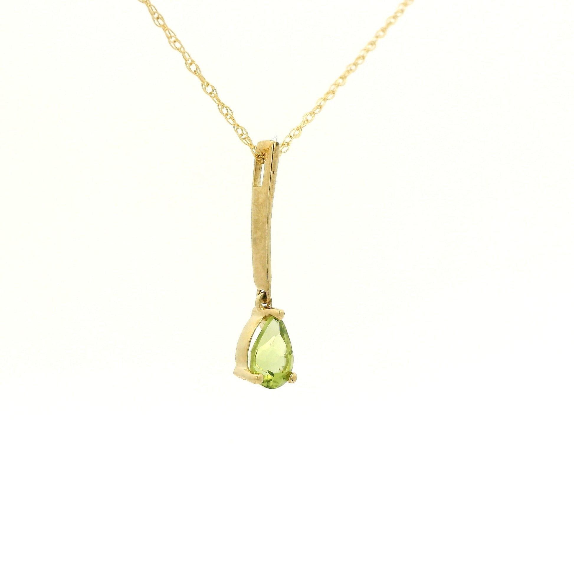 Yellow Gold Dangle Pendant with a prong set pear cut natural Peridot at Forever Rox Fine Jewelry, Lake Tahoes Best Jewelry Store

