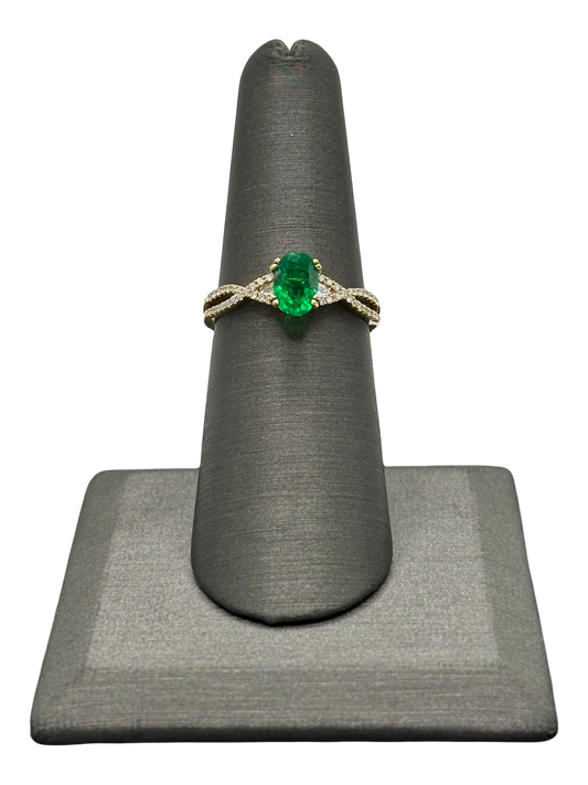 Oval Cut Emerald Ring With Two Tapered Baguettes & Diamond Down Crossover Split Shank