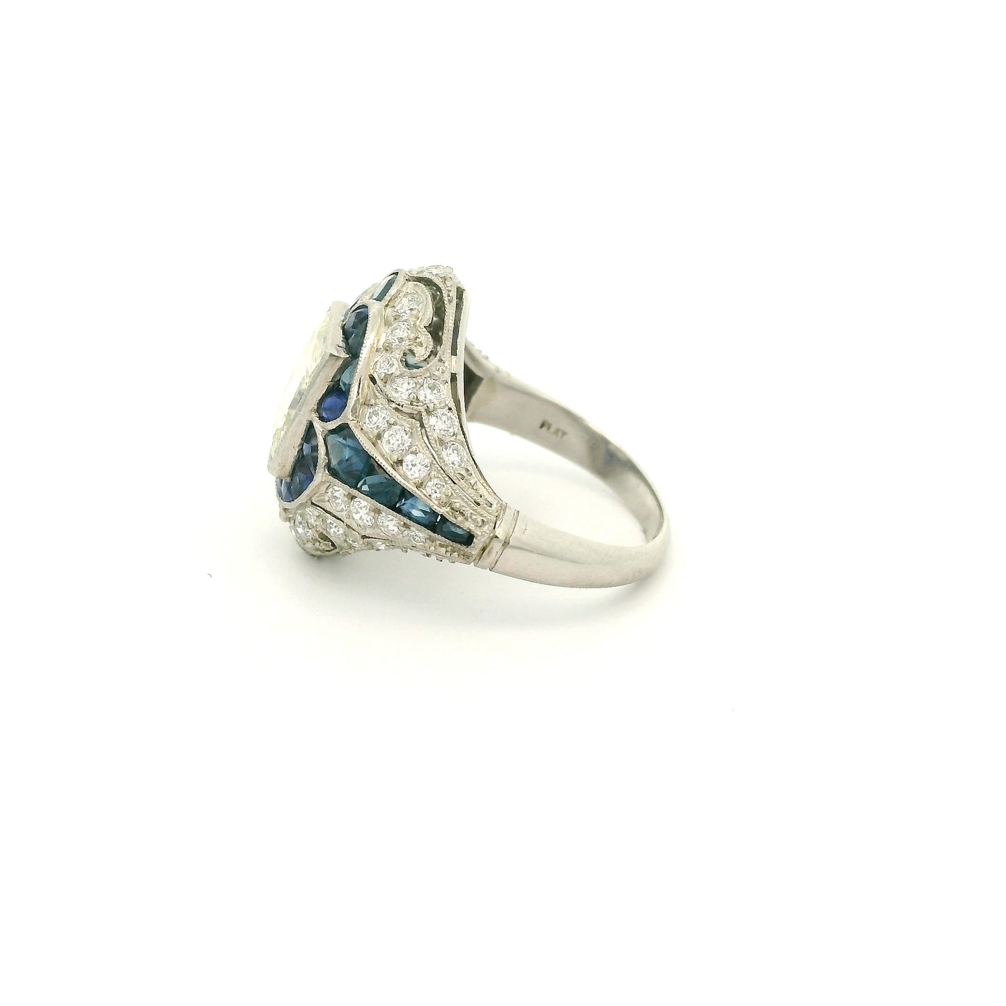 A Platinum Ring with a bezel set princess cut natural Diamond in the center with Sapphire and diamonds all around the ring at Forever Rox Fine Jewelry, Lake Tahoes Best Jewelry Store