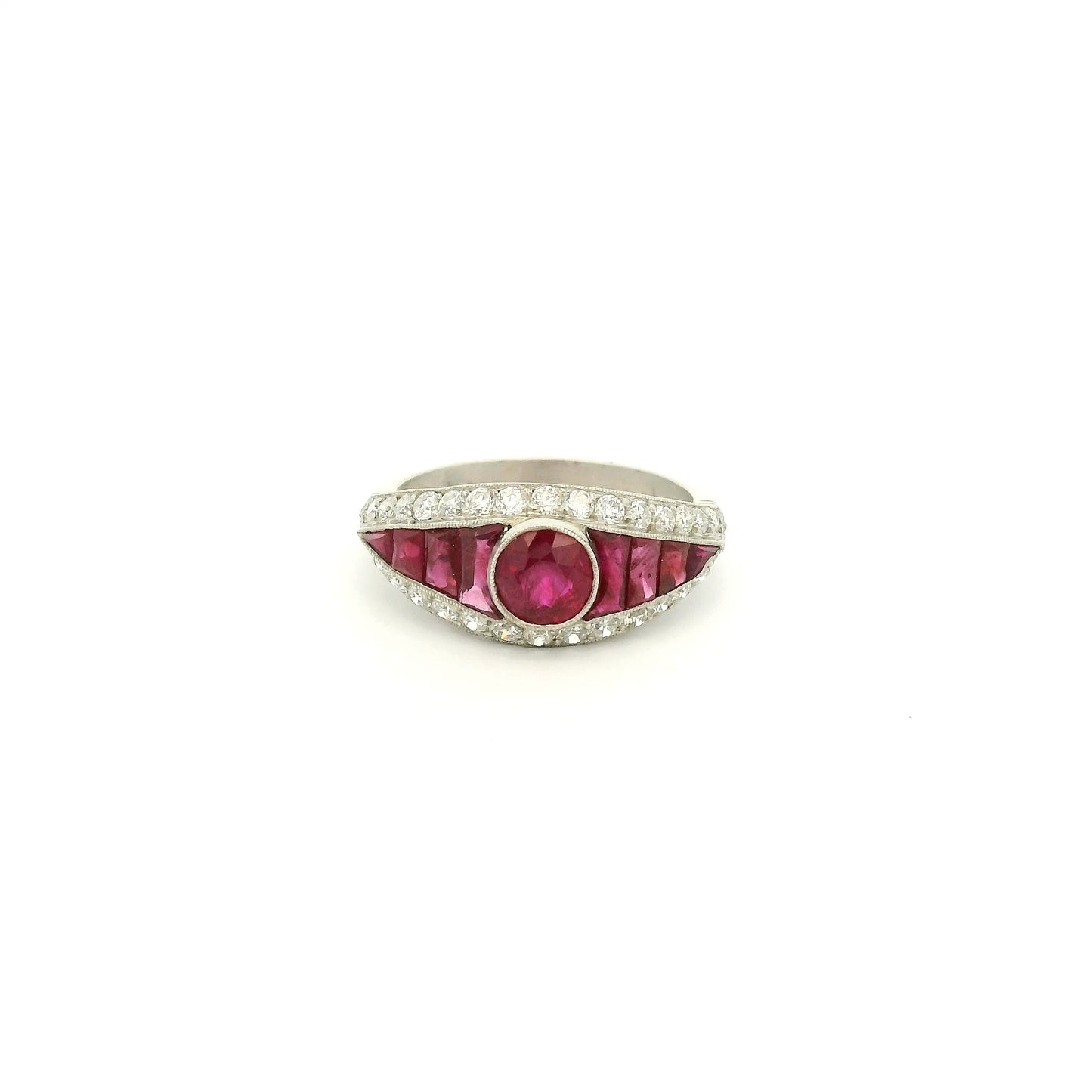 A Platinum Ring with a bezel set round cut natural Ruby in the center with baguette cut rubies and diamonds at Forever Rox Fine Jewelry, Lake Tahoes Best Jewelry Store