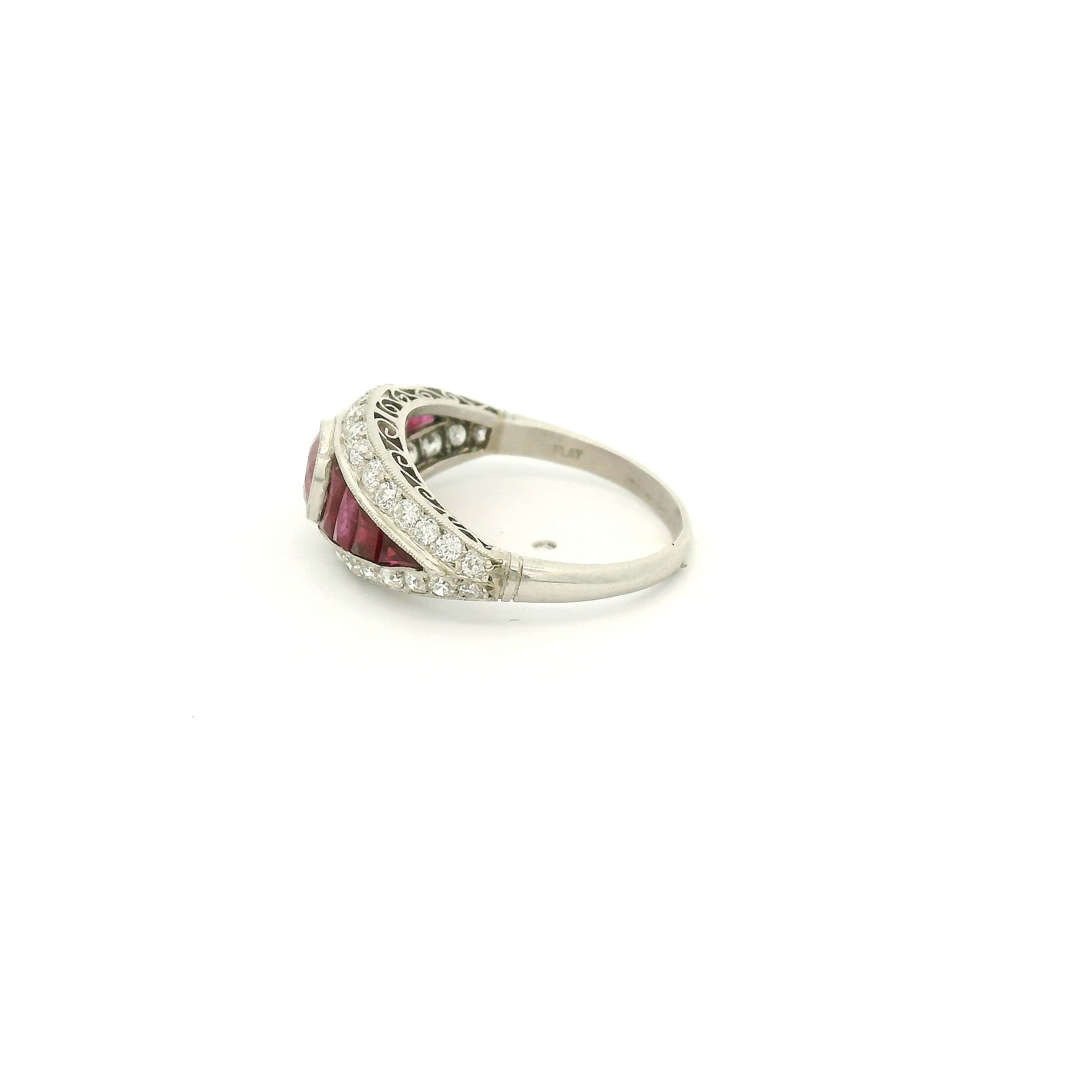 A Platinum Ring with a bezel set round cut natural Ruby in the center with baguette cut rubies and diamonds at Forever Rox Fine Jewelry, Lake Tahoes Best Jewelry Store