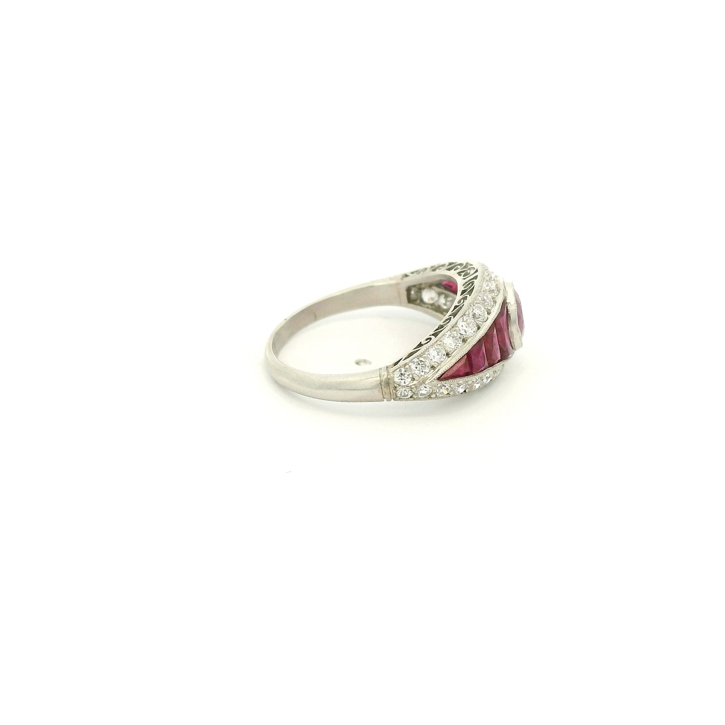 A Platinum Ring with a bezel set round cut natural Ruby in the center with baguette cut rubies and diamonds at Forever Rox Fine Jewelry, Lake Tahoes Best Jewelry Store