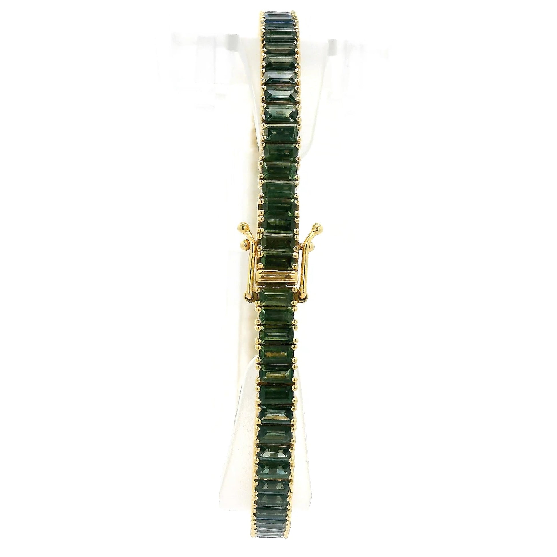A Yellow Gold Bracelet with baguette cut green & blue natural Sapphires at Forever Rox Fine Jewelry, Lake Tahoes Best Jewelry Store