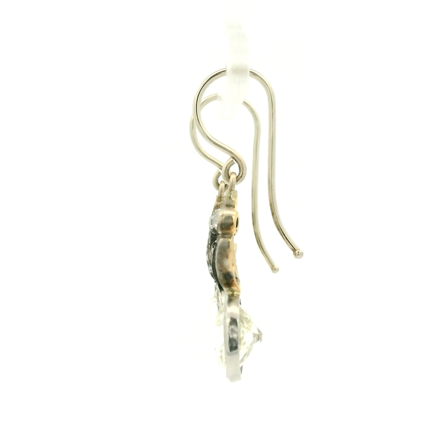 A Pair of White Gold Victorian Dangle Earrings with bezel set old mine cut natural Diamonds in the center with diamonds dangling down at Forever Rox Fine Jewelry, Lake Tahoes Best Jewelry Store