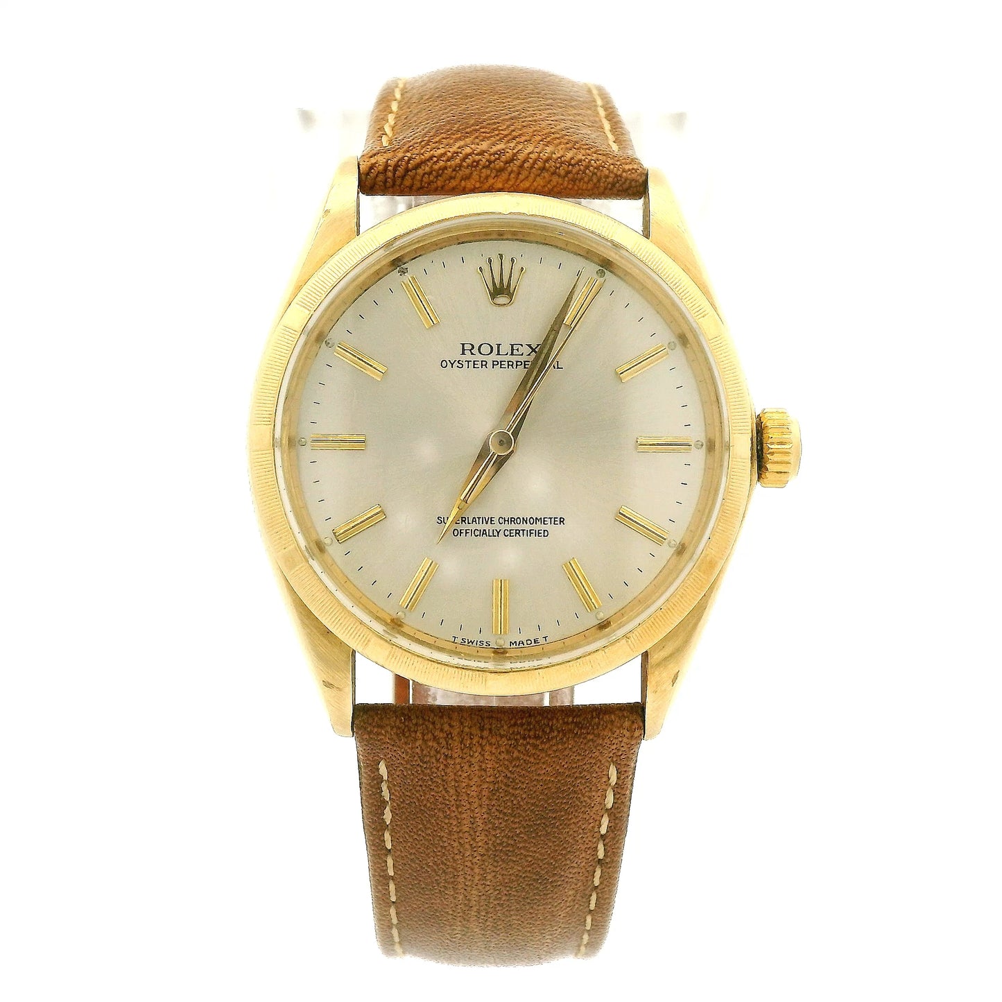 A vintage Rolex Oyster Perpetual watch with a gold-tone case, cream-colored dial, and a brown leather strap, shown against a plain white background at Forever Rox Fine Jewelry, Lake Tahoes Best Jewelry Store