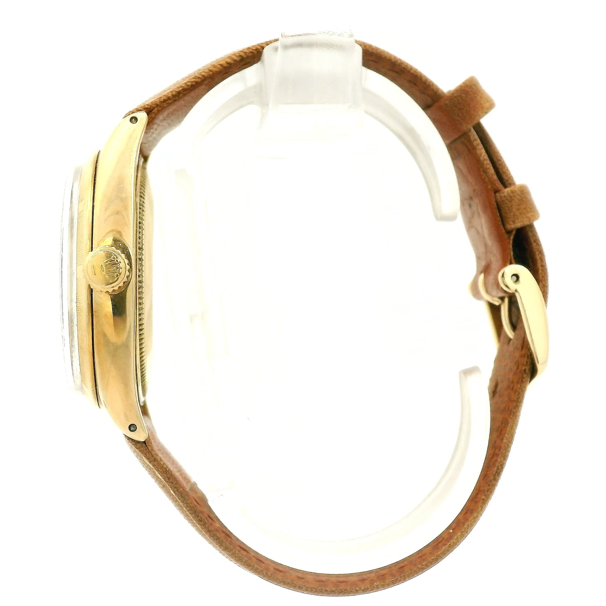 A vintage Rolex Oyster Perpetual watch with a gold-tone case, cream-colored dial, and a brown leather strap, shown against a plain white background at Forever Rox Fine Jewelry, Lake Tahoes Best Jewelry Store
