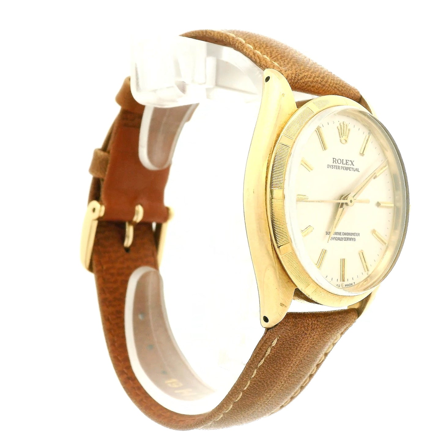 A vintage Rolex Oyster Perpetual watch with a gold-tone case, cream-colored dial, and a brown leather strap, shown against a plain white background at Forever Rox Fine Jewelry, Lake Tahoes Best Jewelry Store