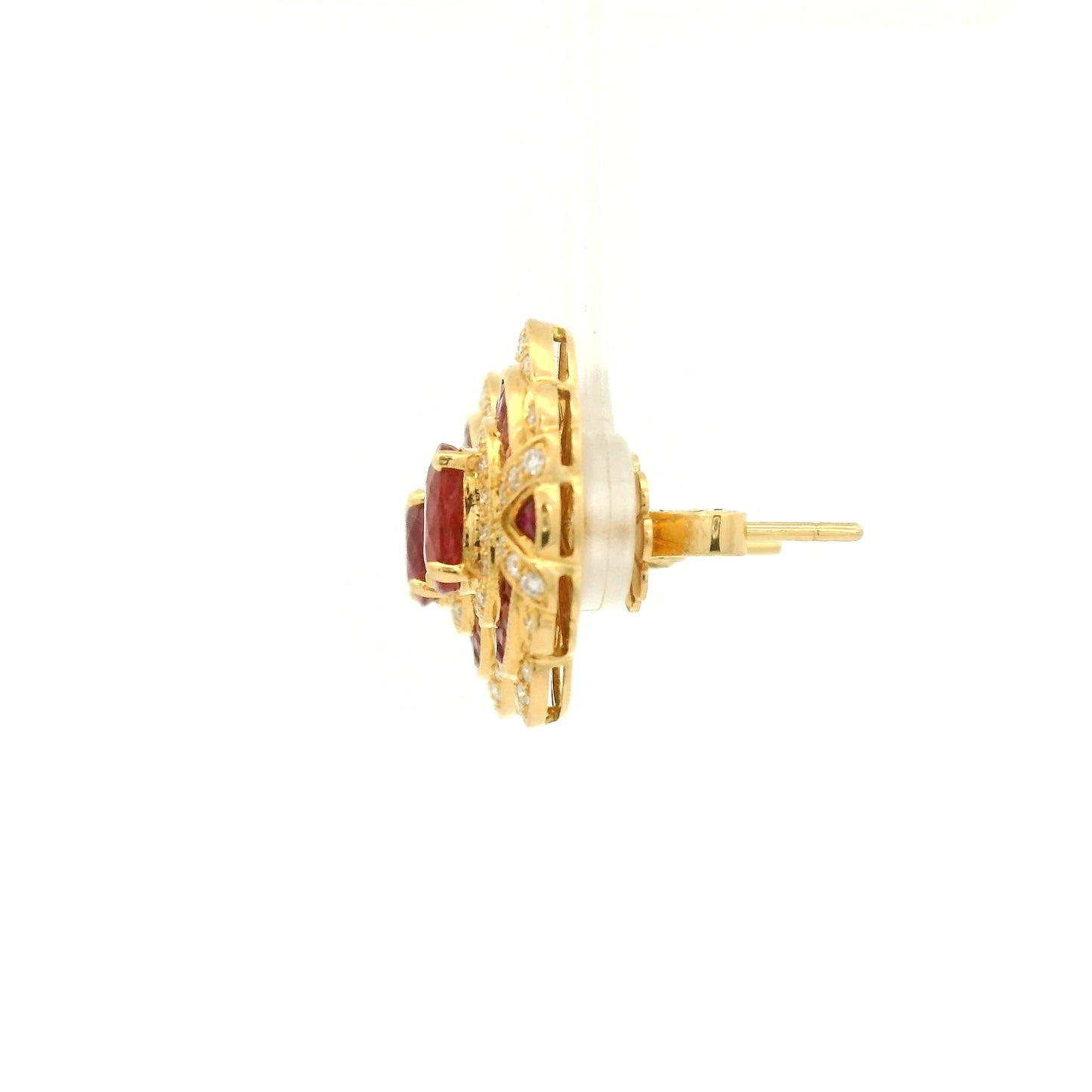 A Pair of Yellow Gold Earrings with prong set oval cut natural Rubies in the center with french cut rubies and diamonds around them at Forever Rox Fine Jewelry, Lake Tahoes Best Jewelry Store