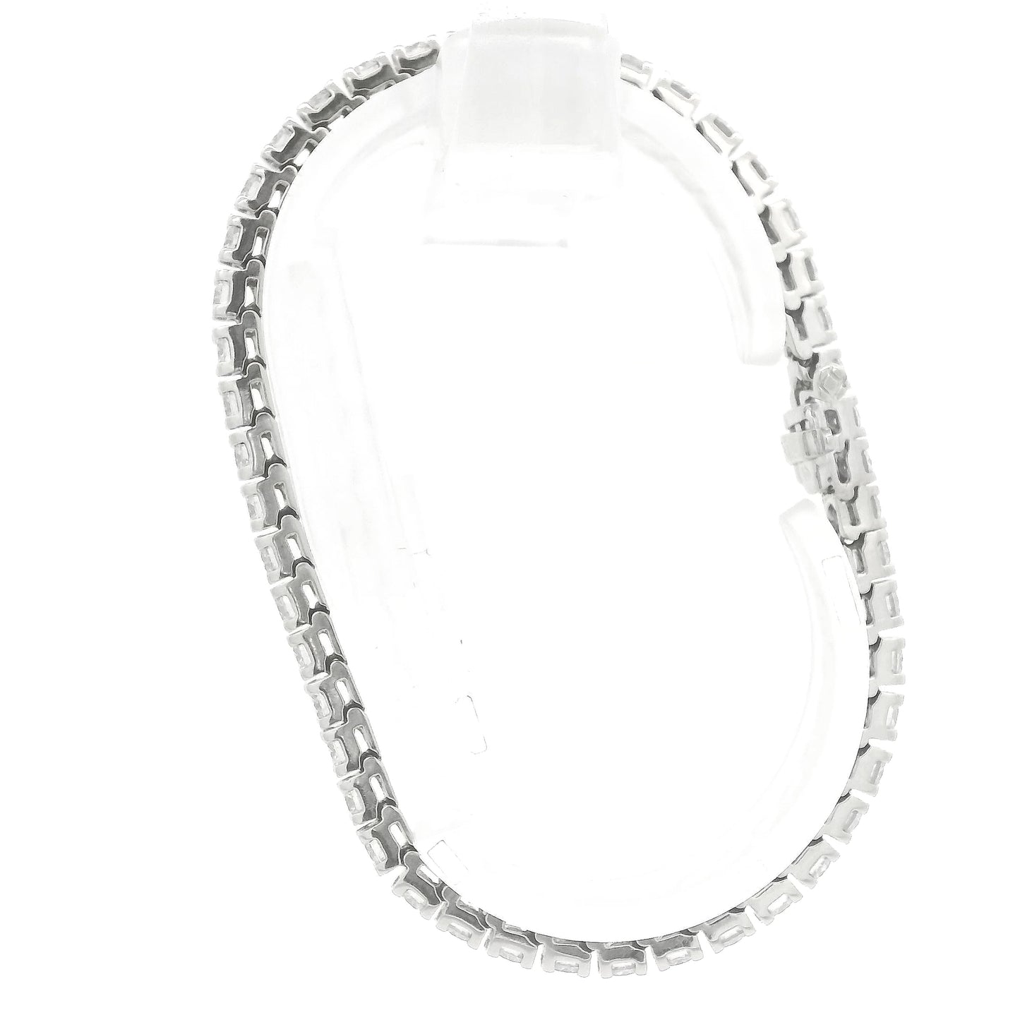 A single white gold diamond tennis bracelet displayed vertically on a clear stand against a plain white background at Forever Rox Fine Jewelry, Lake Tahoes Best Jewelry Store