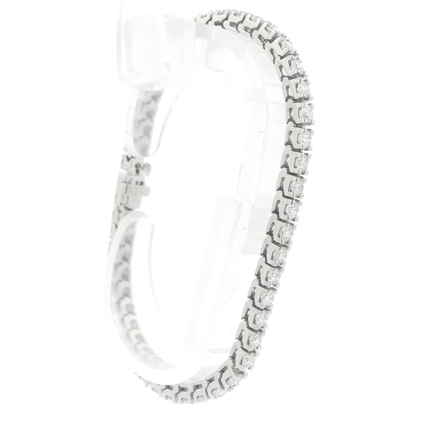 A single white gold diamond tennis bracelet displayed vertically on a clear stand against a plain white background at Forever Rox Fine Jewelry, Lake Tahoes Best Jewelry Store