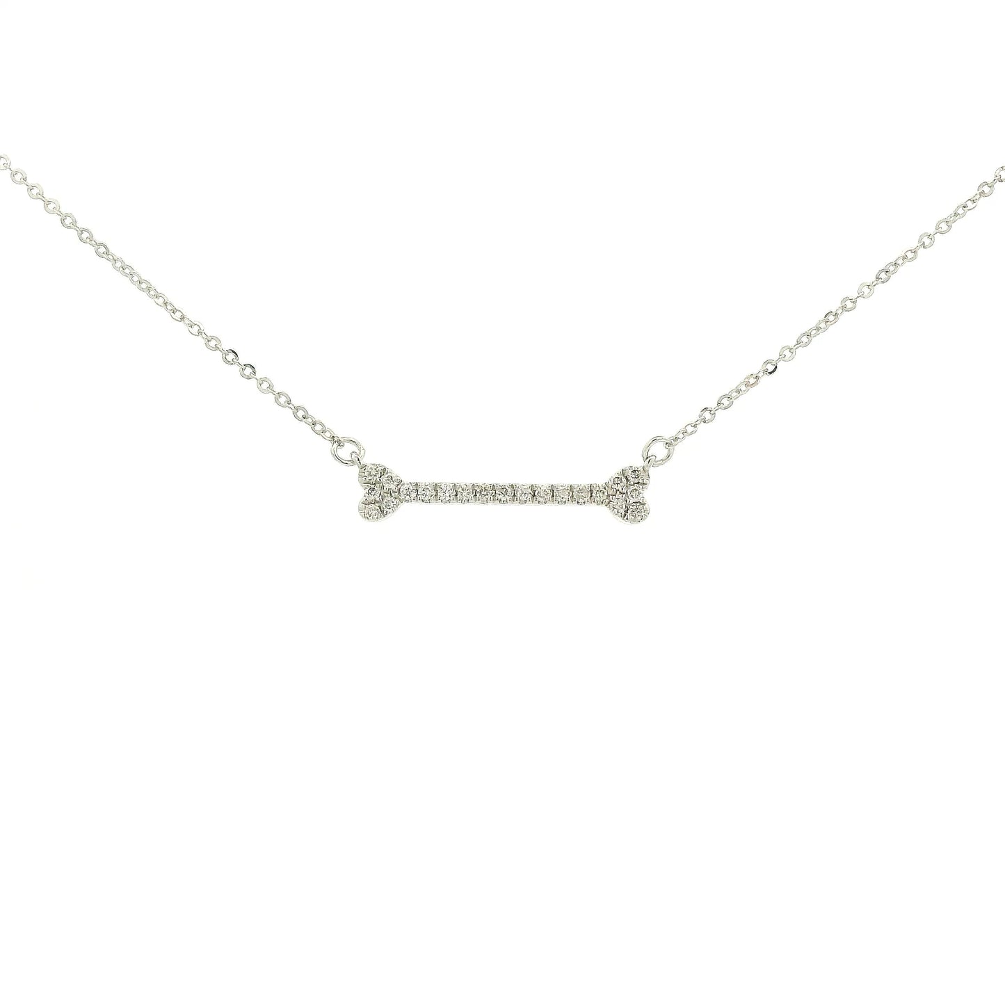 A White Gold Dog Bone Pendant with diamonds at Forever Rox Fine Jewelry, Lake Tahoes Best Jewelry Store