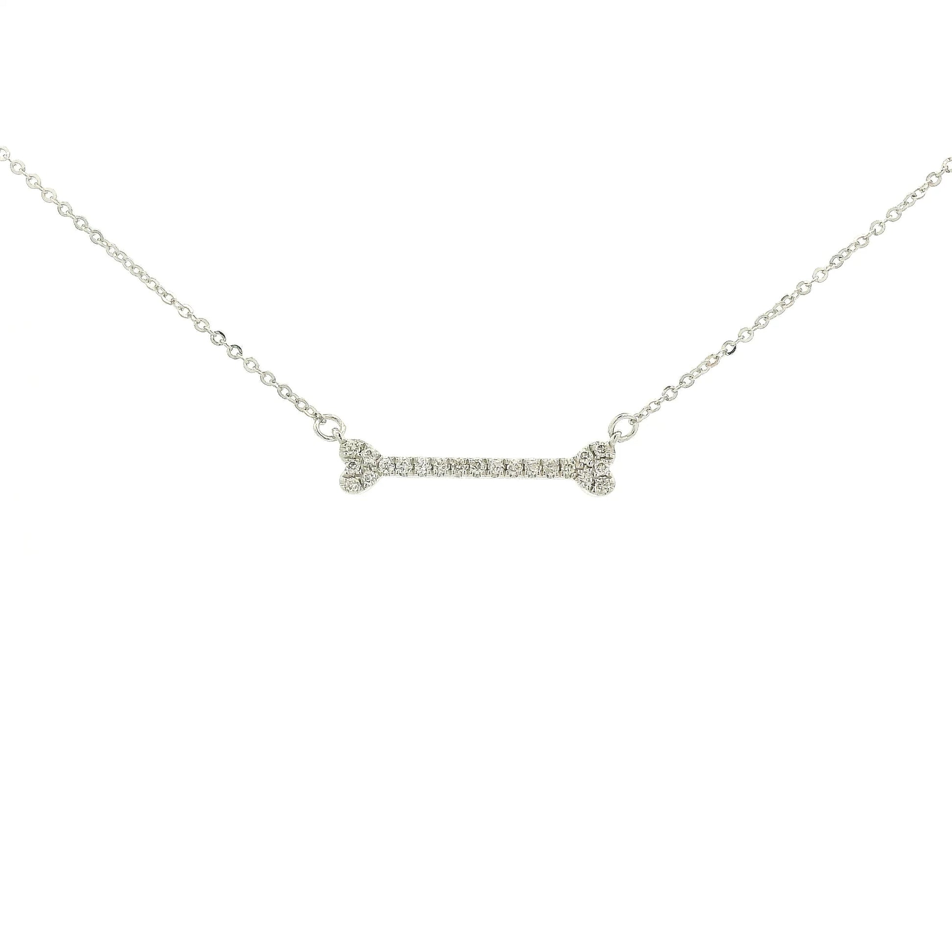 A White Gold Dog Bone Pendant with diamonds at Forever Rox Fine Jewelry, Lake Tahoes Best Jewelry Store