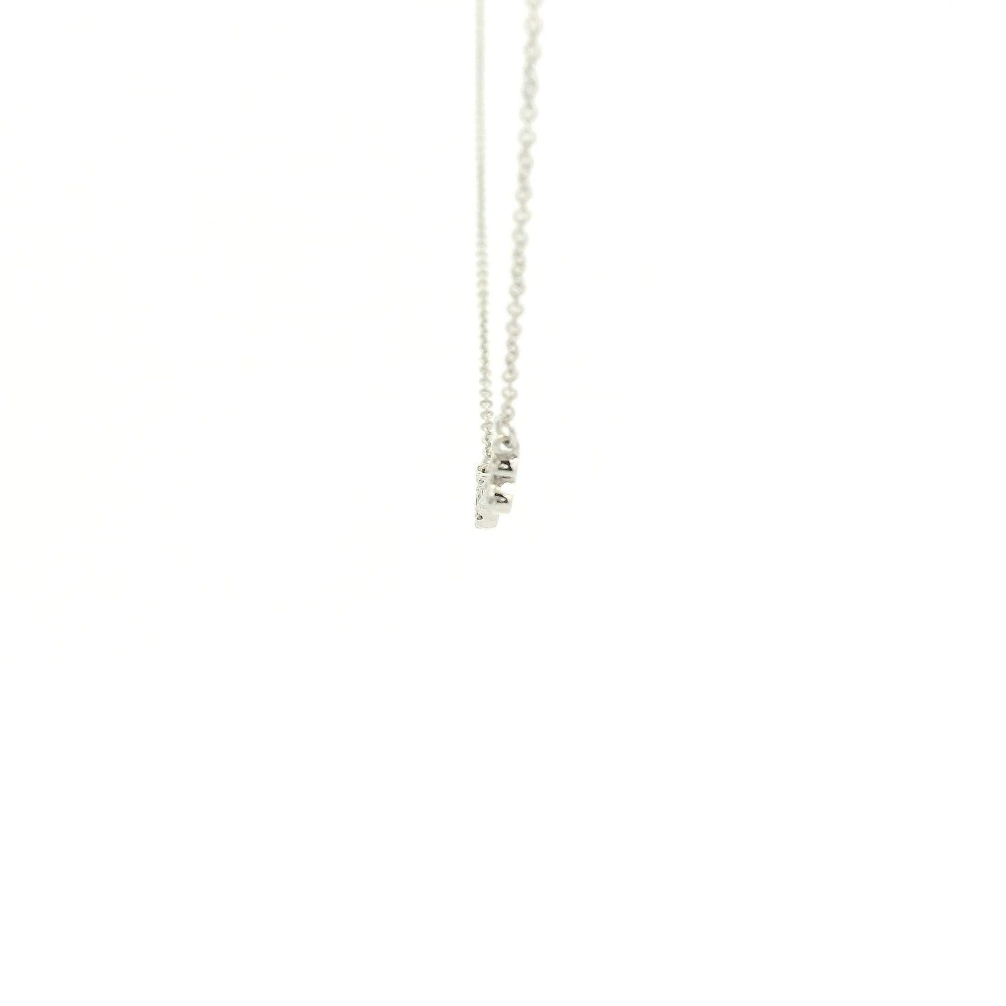 A White Gold Dog Bone Pendant with diamonds at Forever Rox Fine Jewelry, Lake Tahoes Best Jewelry Store