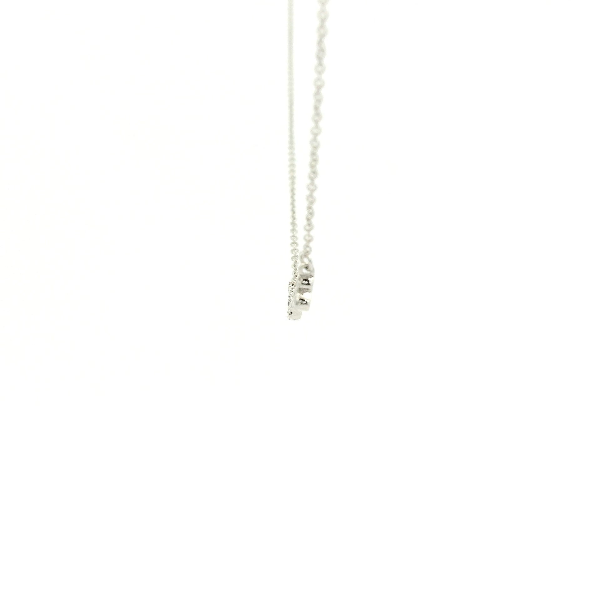 A White Gold Dog Bone Pendant with diamonds at Forever Rox Fine Jewelry, Lake Tahoes Best Jewelry Store