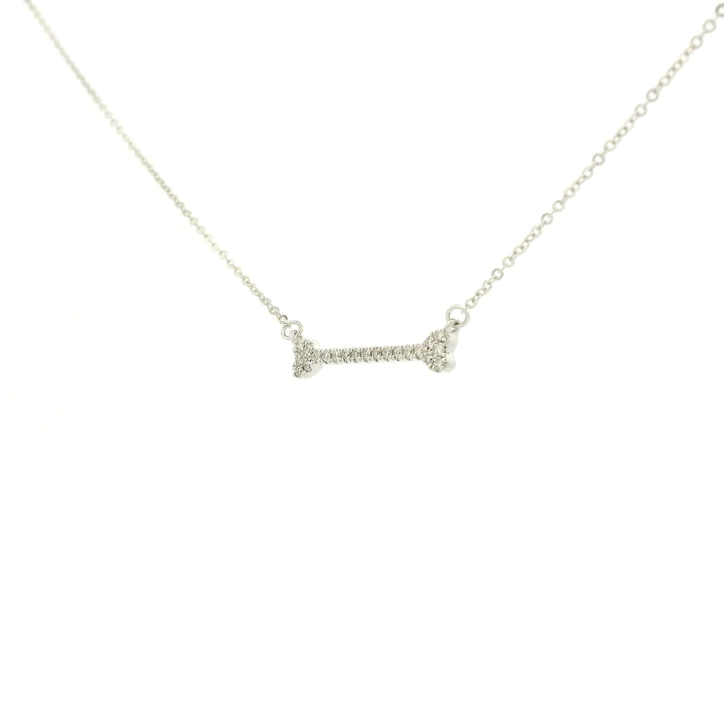 A White Gold Dog Bone Pendant with diamonds at Forever Rox Fine Jewelry, Lake Tahoes Best Jewelry Store