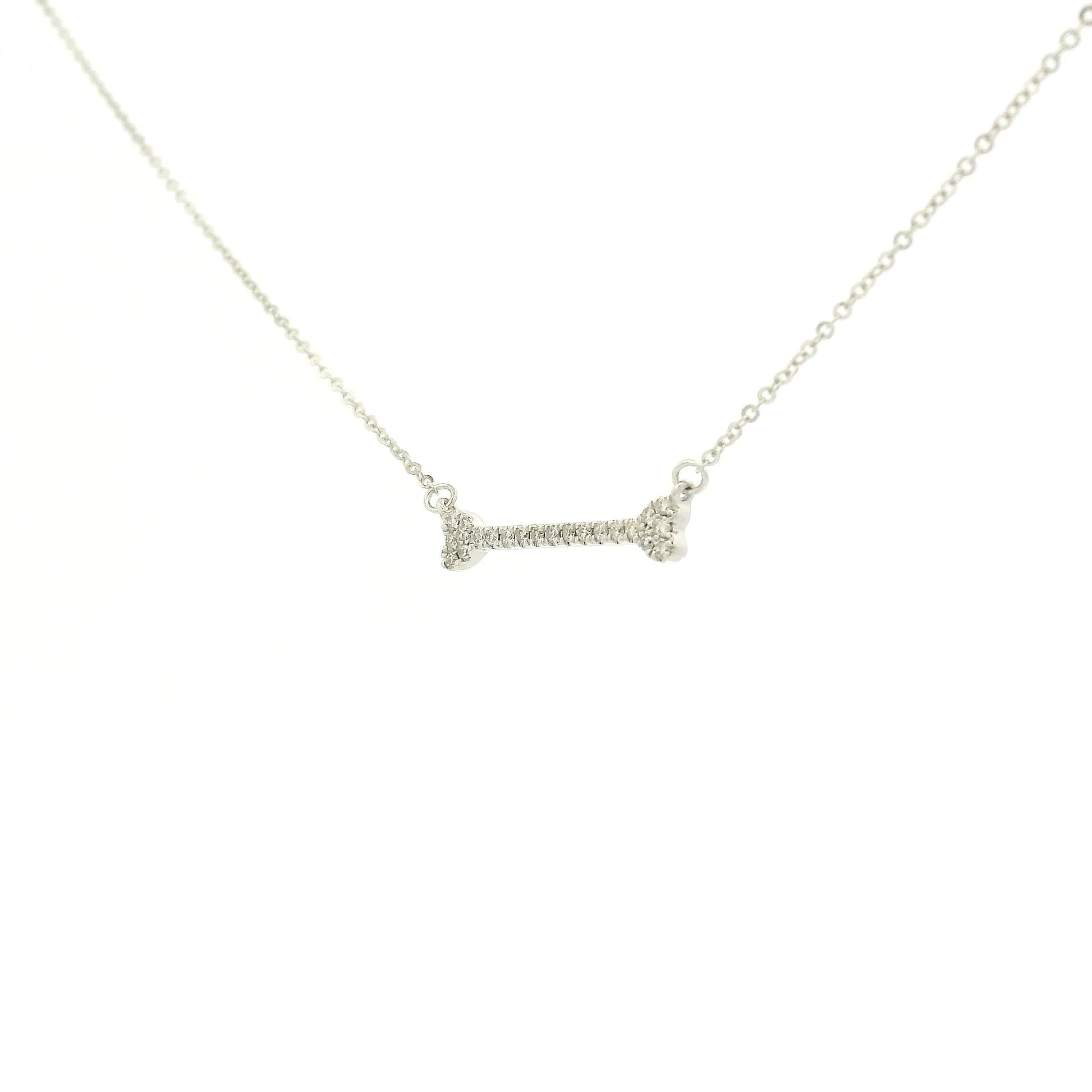 A White Gold Dog Bone Pendant with diamonds at Forever Rox Fine Jewelry, Lake Tahoes Best Jewelry Store