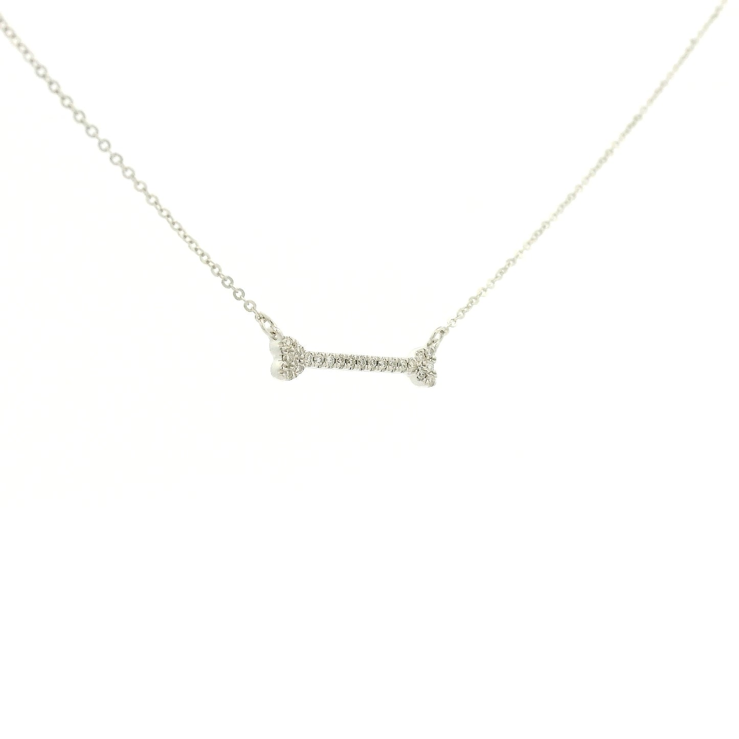 A White Gold Dog Bone Pendant with diamonds at Forever Rox Fine Jewelry, Lake Tahoes Best Jewelry Store
