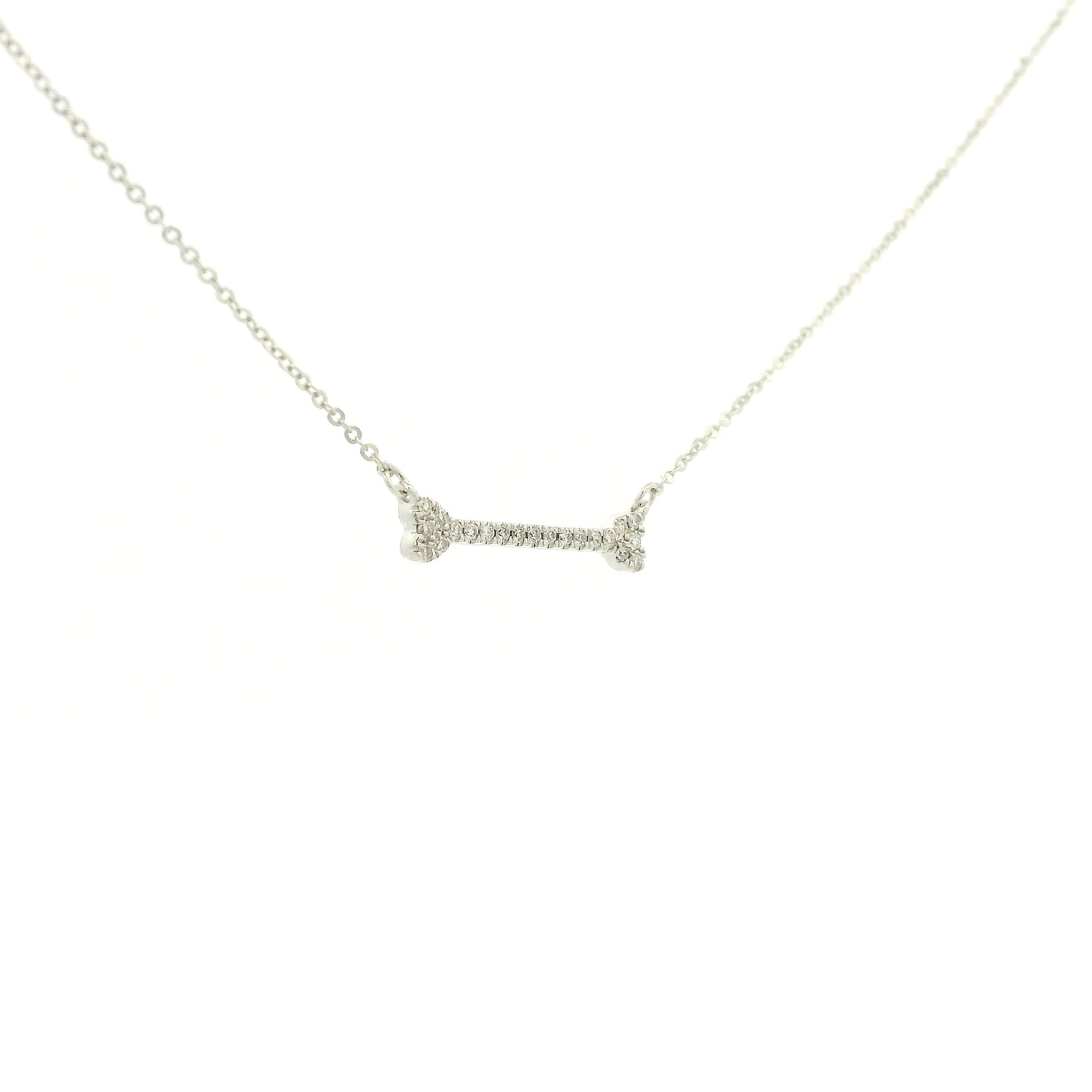 A White Gold Dog Bone Pendant with diamonds at Forever Rox Fine Jewelry, Lake Tahoes Best Jewelry Store